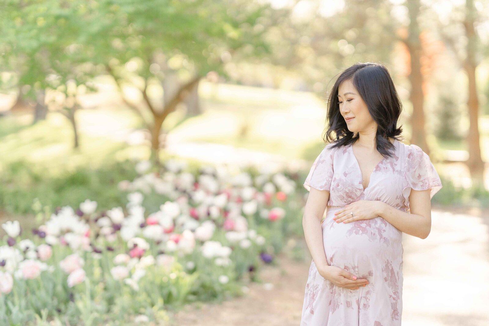mom looking over her shoulder during maternity picture in Ashburn, VA