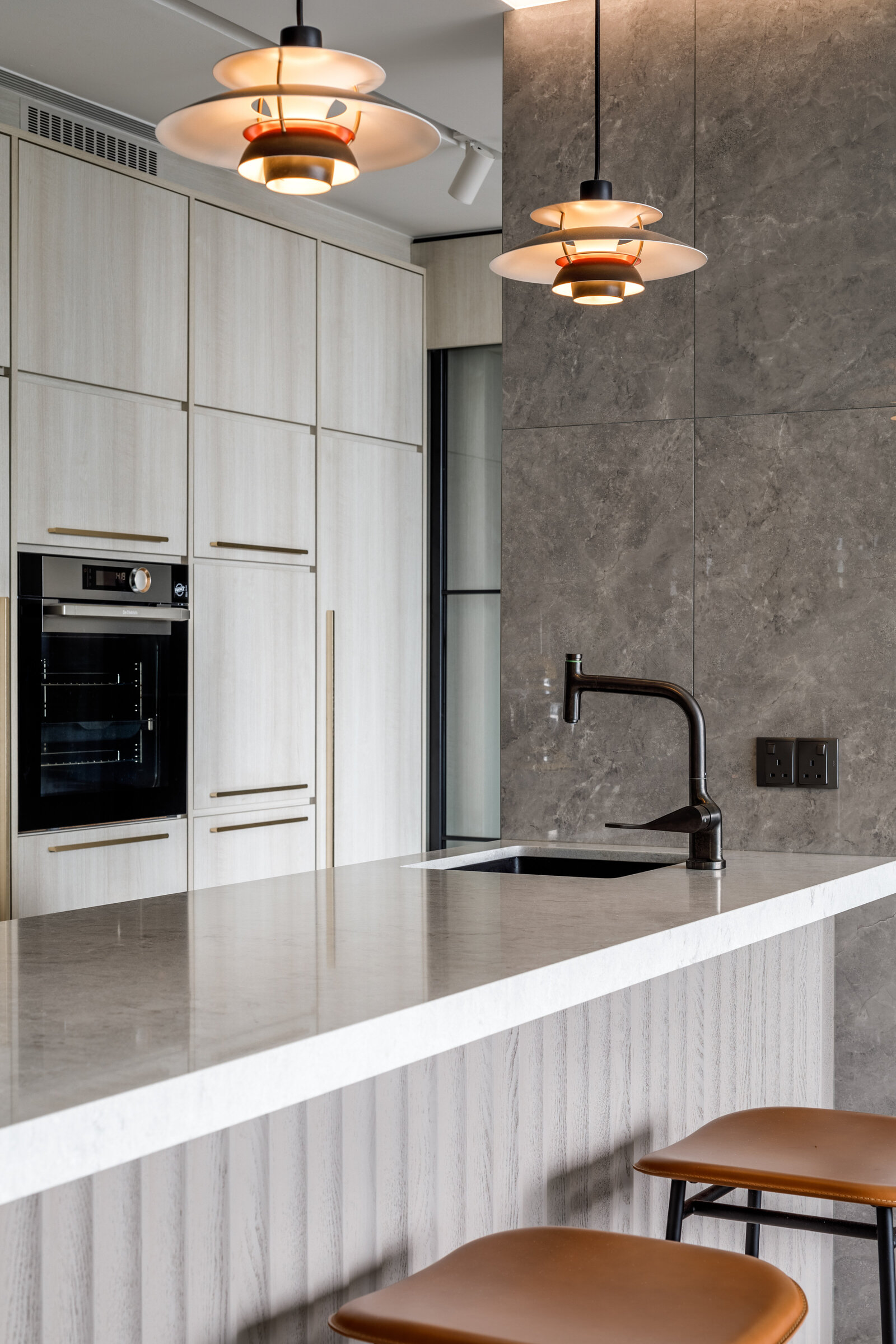 kitchen island with stools and lights