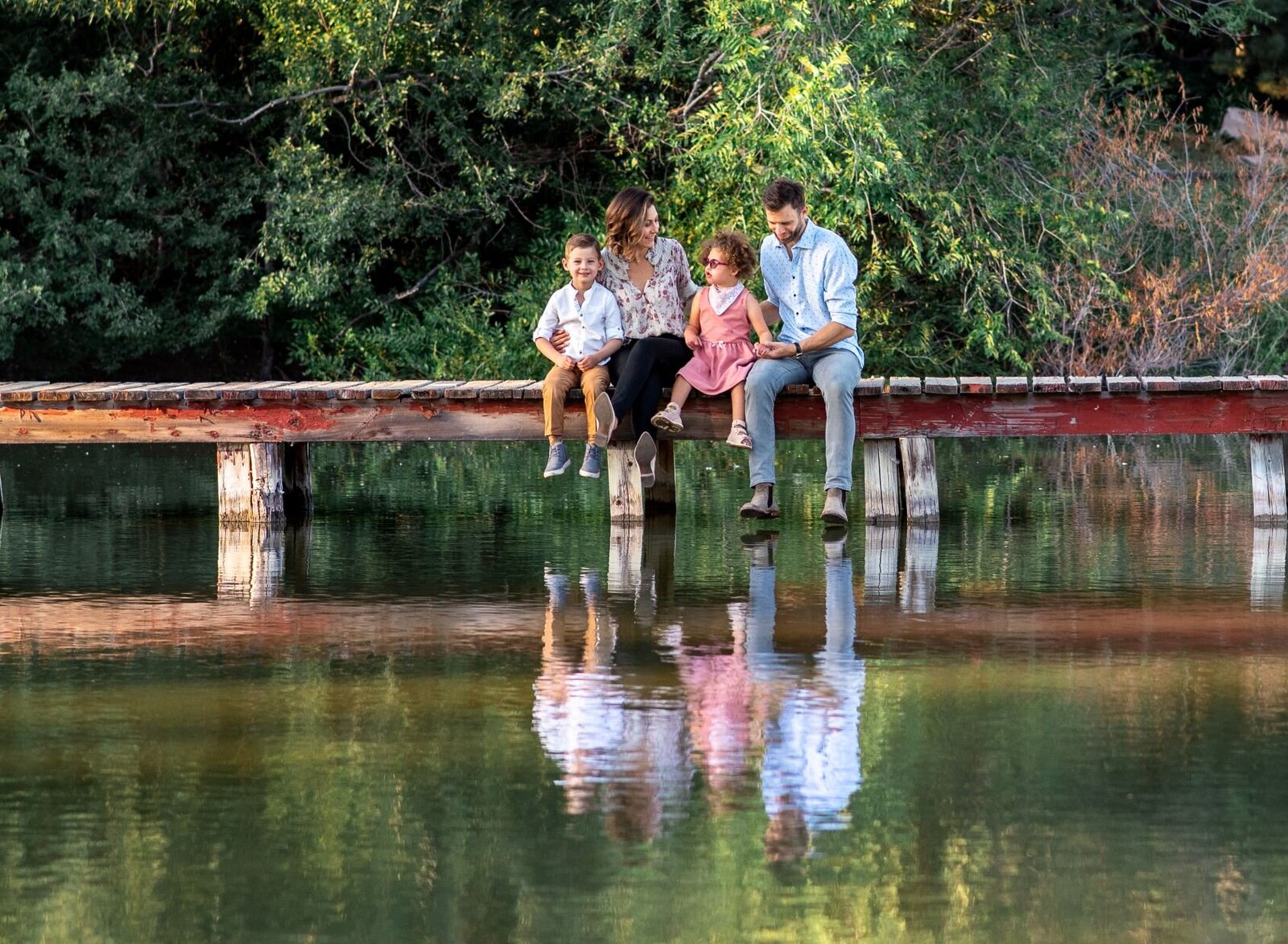 family reflection in water