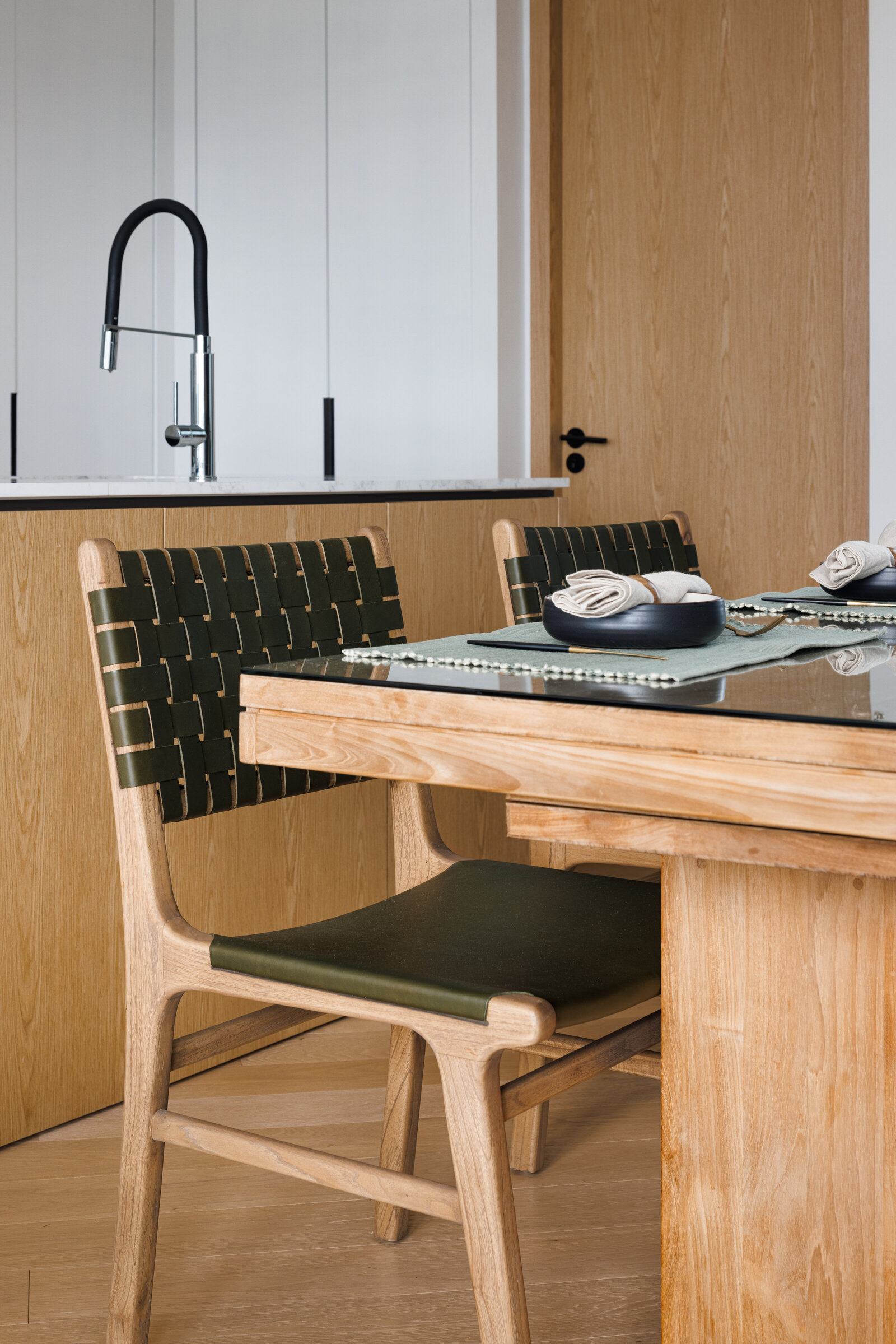 kitchen dining with green chairs