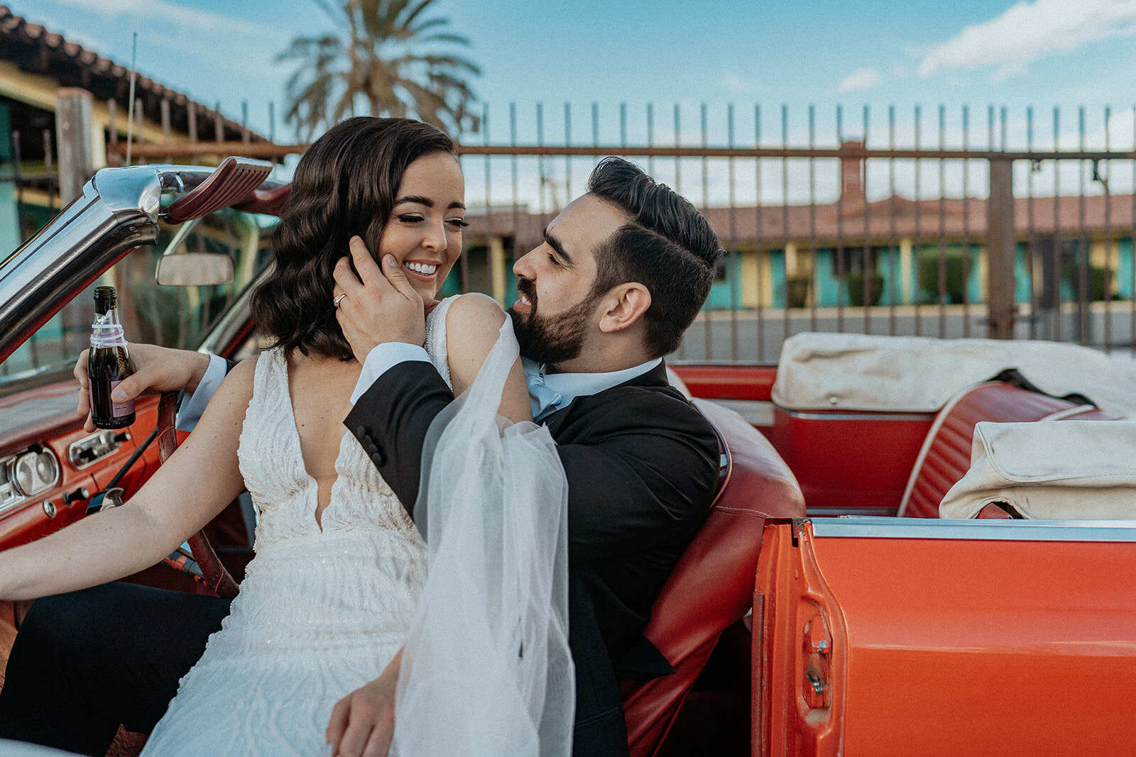 Bride and groom in retro car at The Sure Thing Chapel in Las Vegas, Nevada