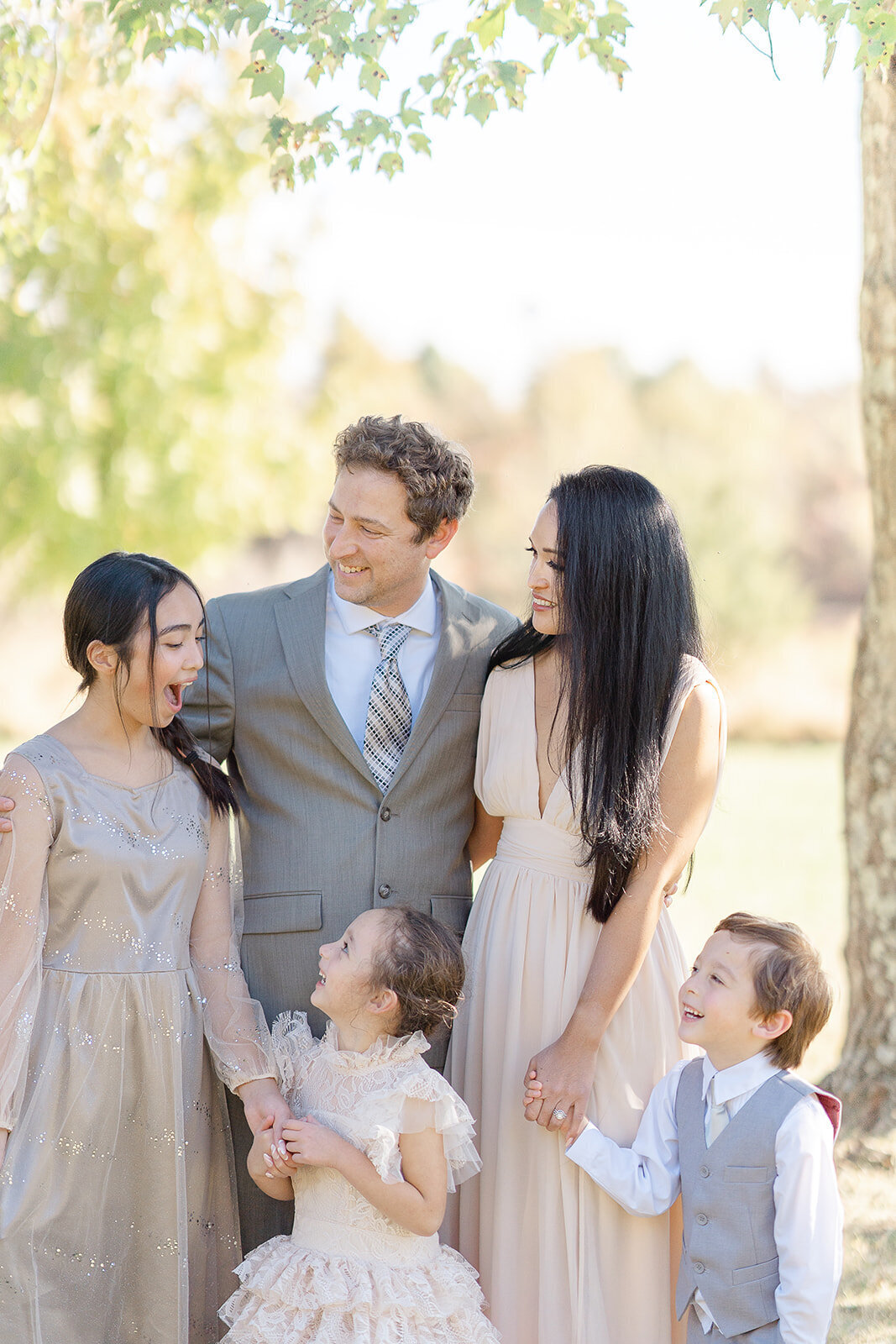 family laughing during fall minis in Reston, Virginia