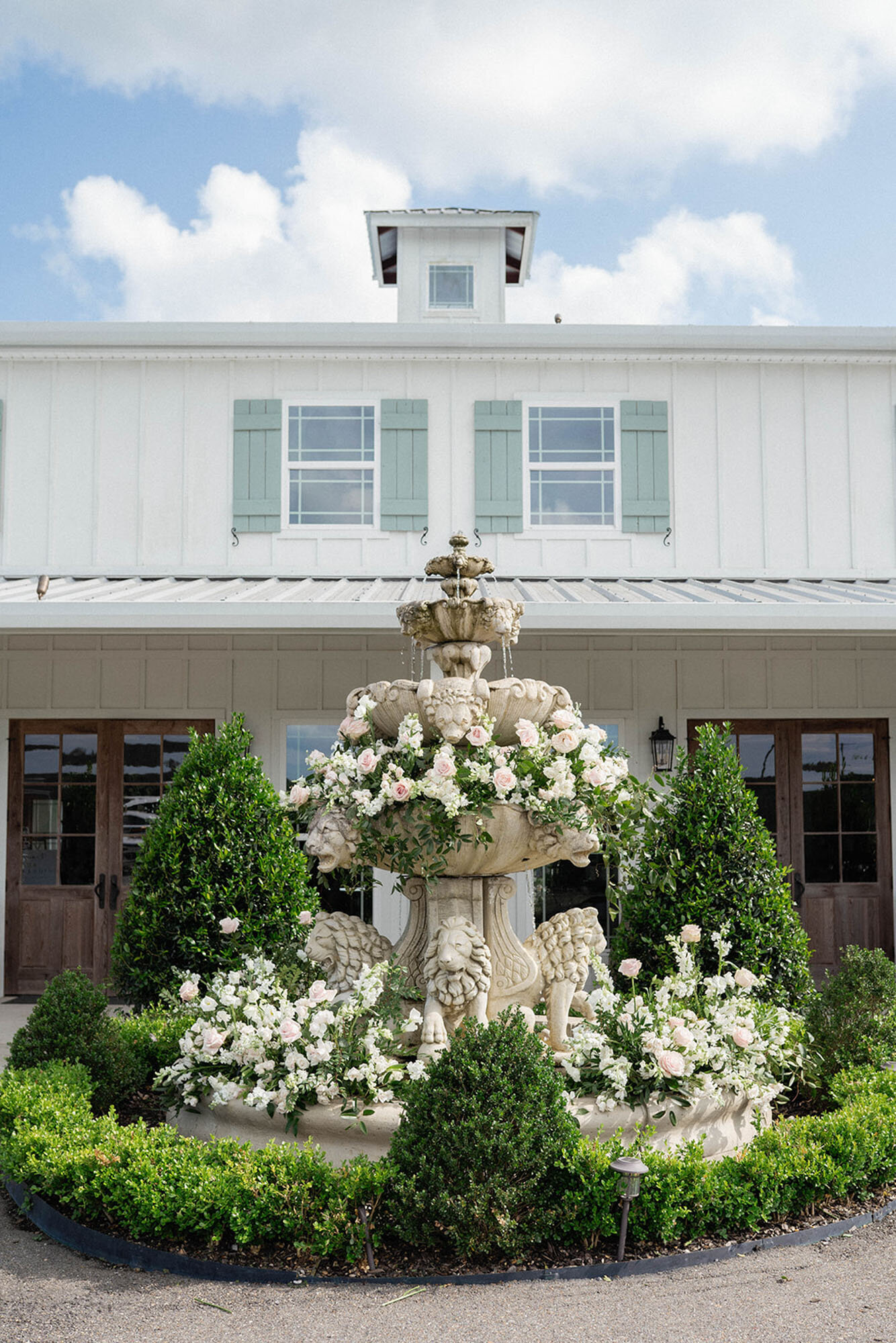 fountain decorated with florals at luxury wedding in New Orleans