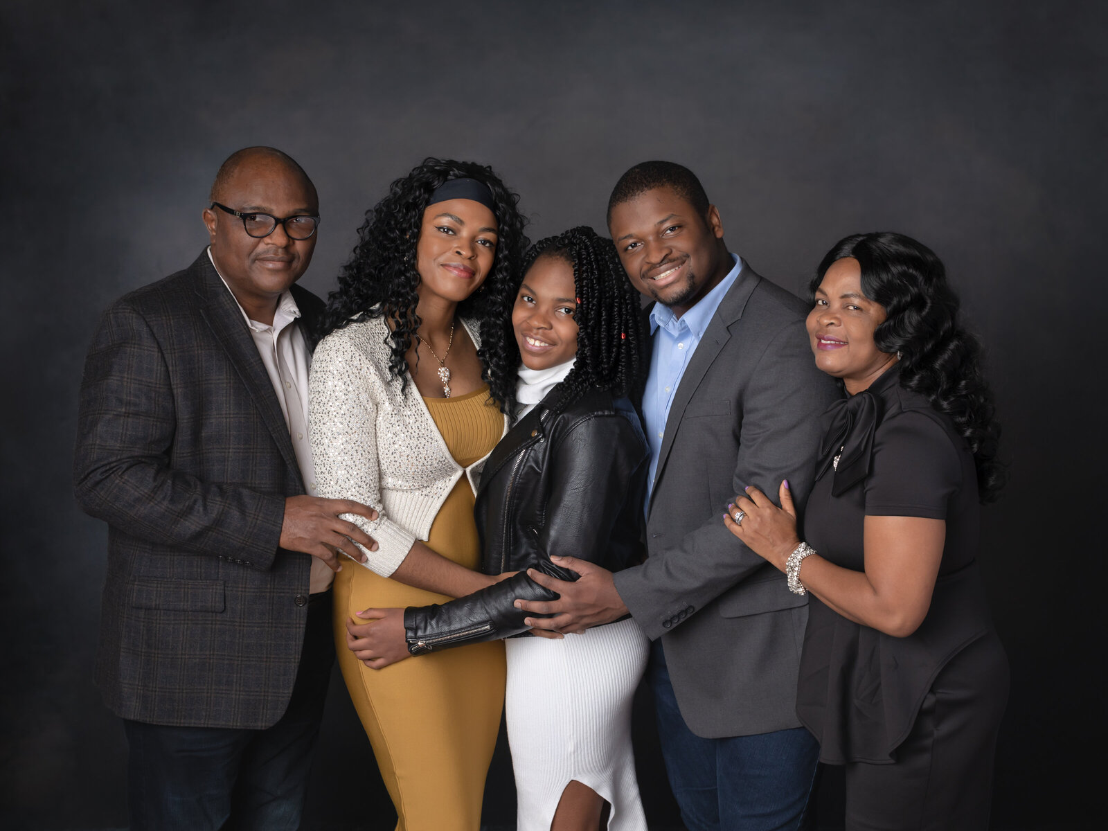 parents and three children hugging for family studio portraits