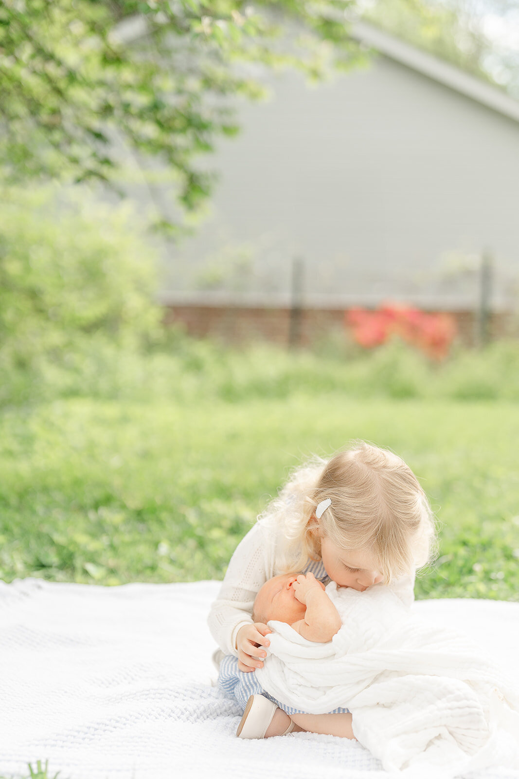 big sister kissing baby brother during Leesburg, VA newborn picture