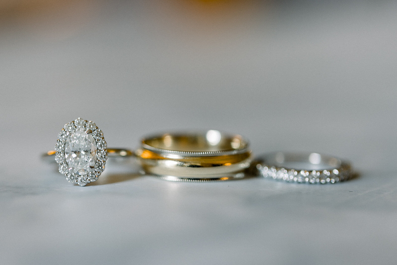 flat lay of wedding and engagement rings