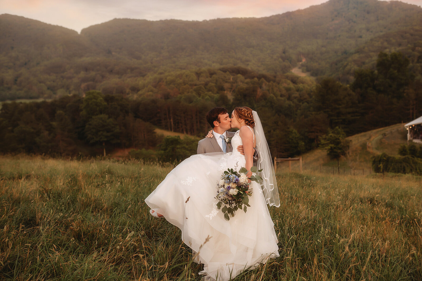 Newlyweds pose for Wedding Photos at Chestnut Ridge Events in Asheville, NC.