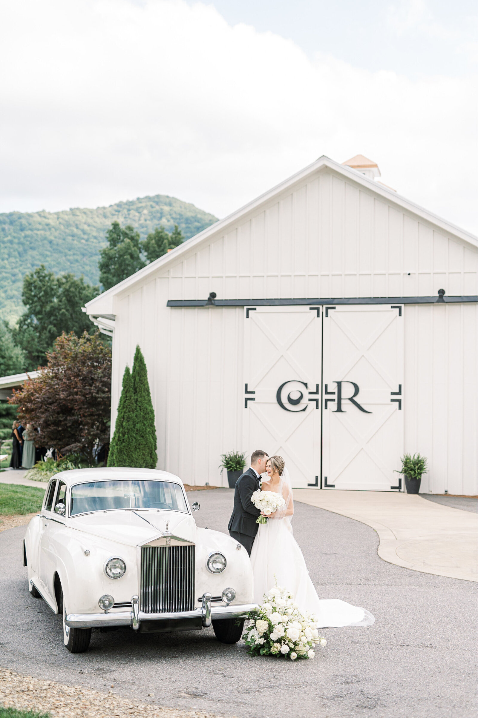 bride and groom with rolls royce summer mountain wedding at Chestnut Ridge Asheville, NC