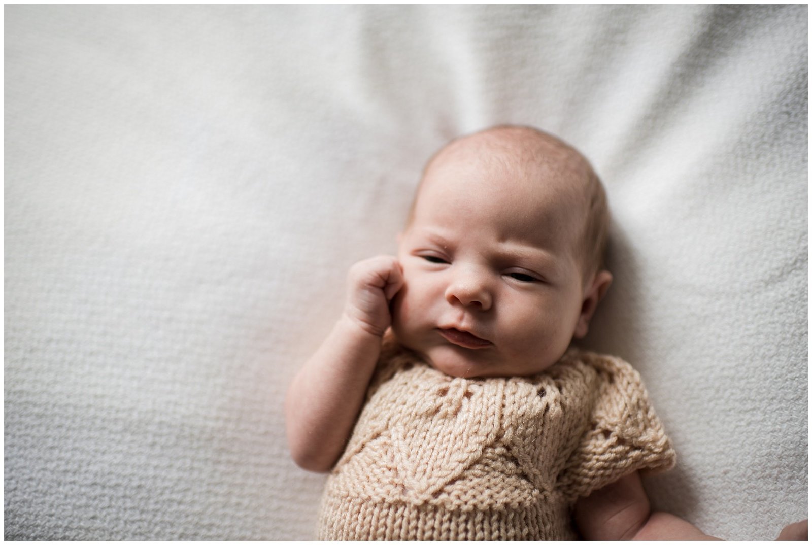 newborn baby girl hand to cheek Emily Ann Photography Seattle Photographer