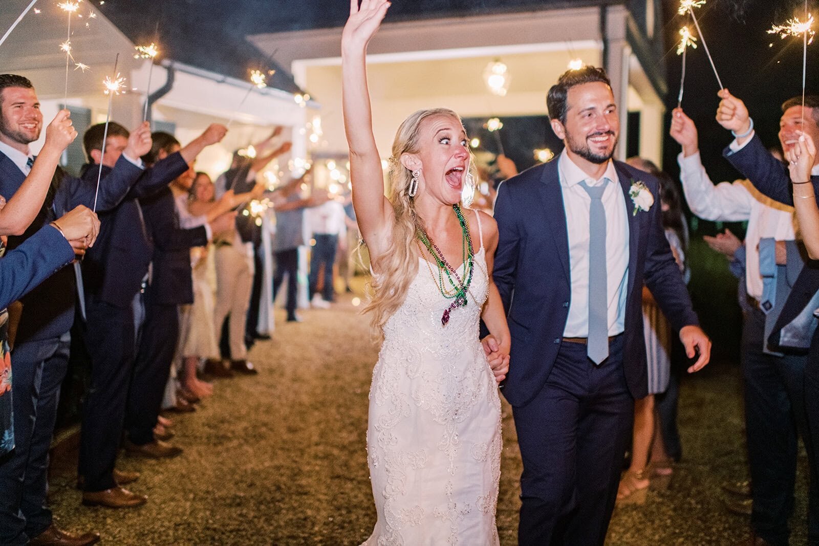 Asheville wedding photographer captures a bride and groom exiting their wedding reception