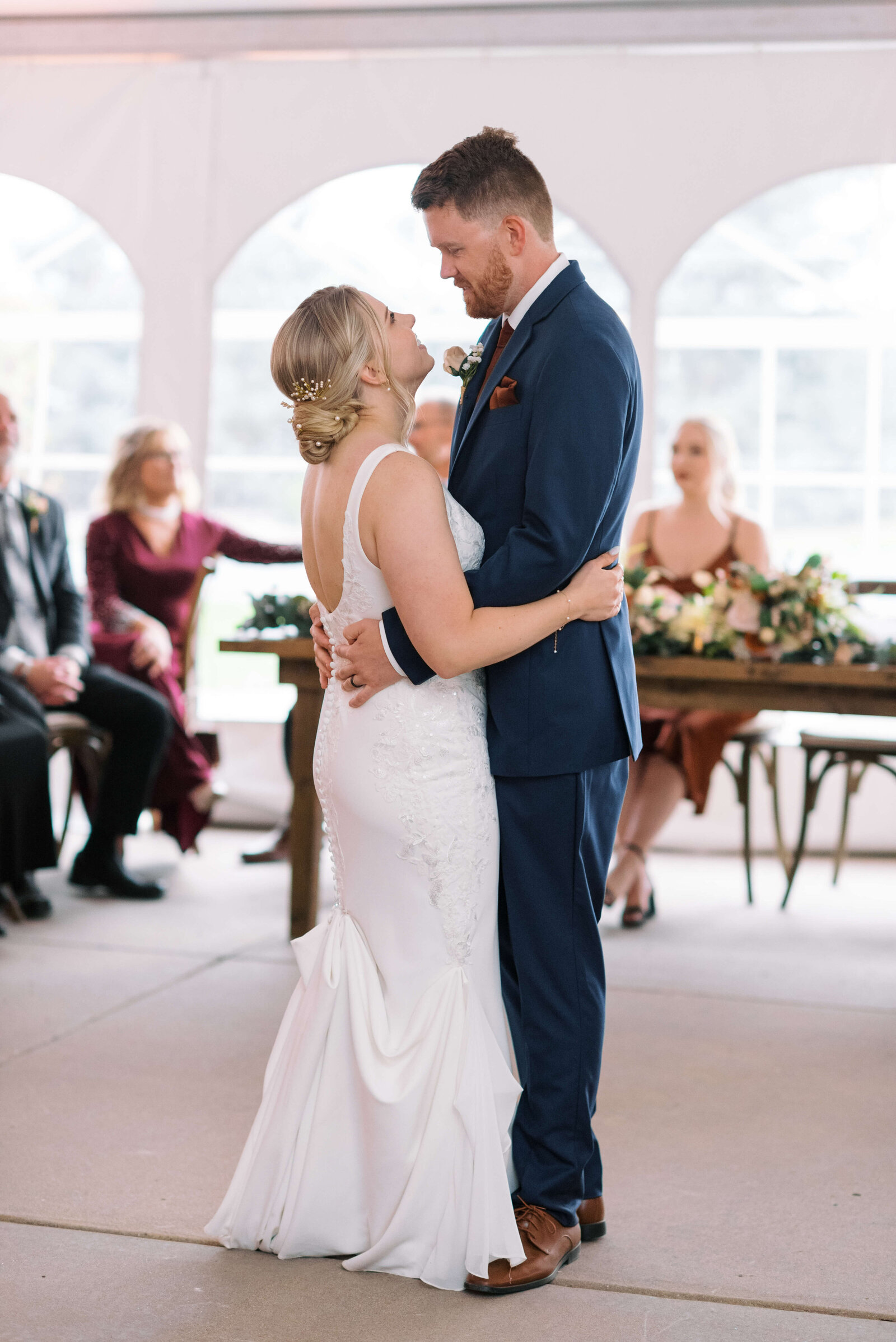 The first dance for this bride and groom took place in a light and airy white tent filled with family and friends