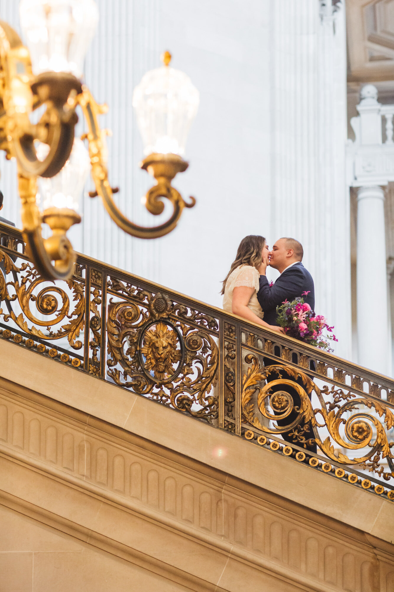 couple on Grand Staircase captured from side angle