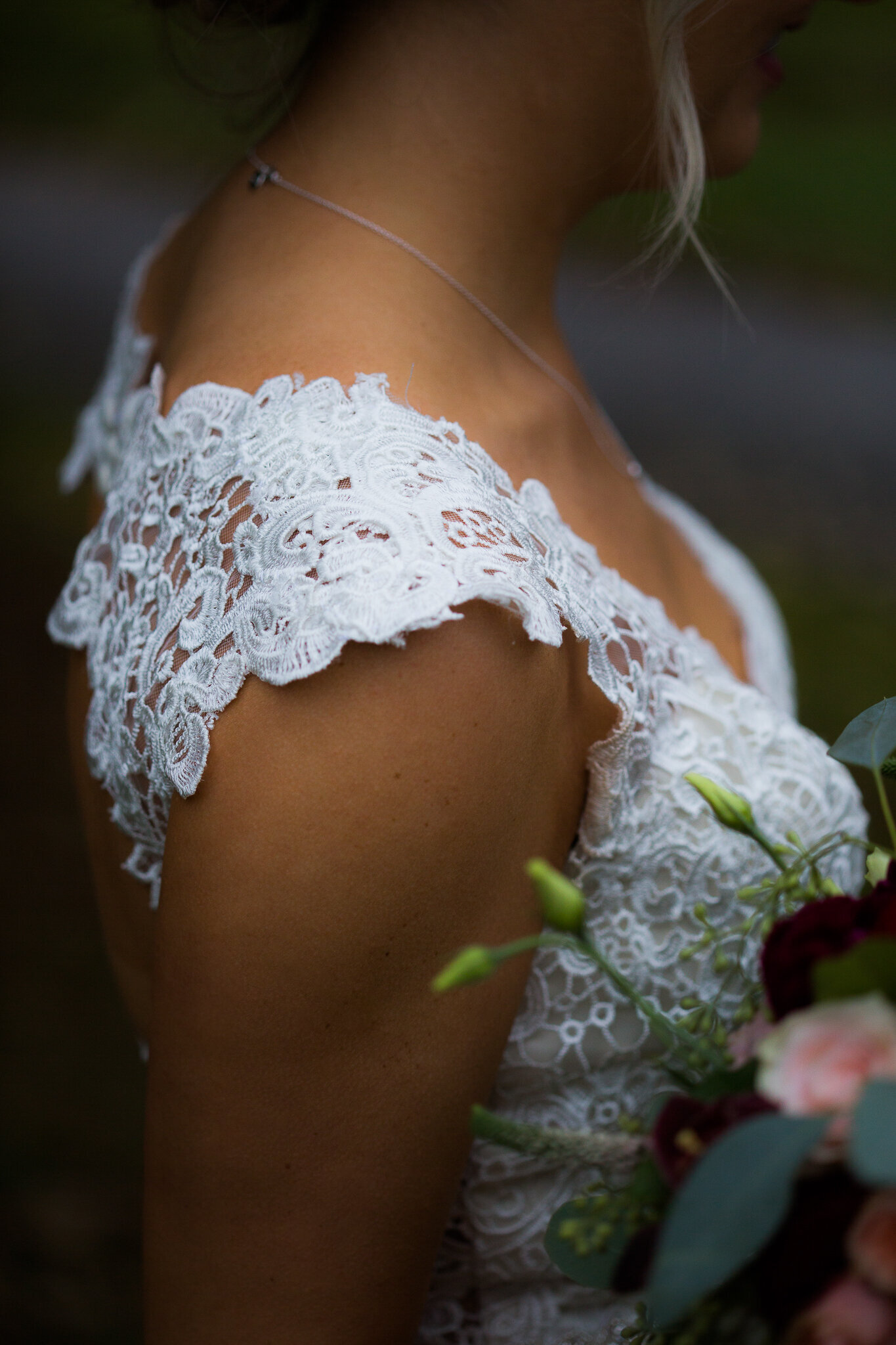 Bridal dress details and wedding bouquet at Hockley Valley.