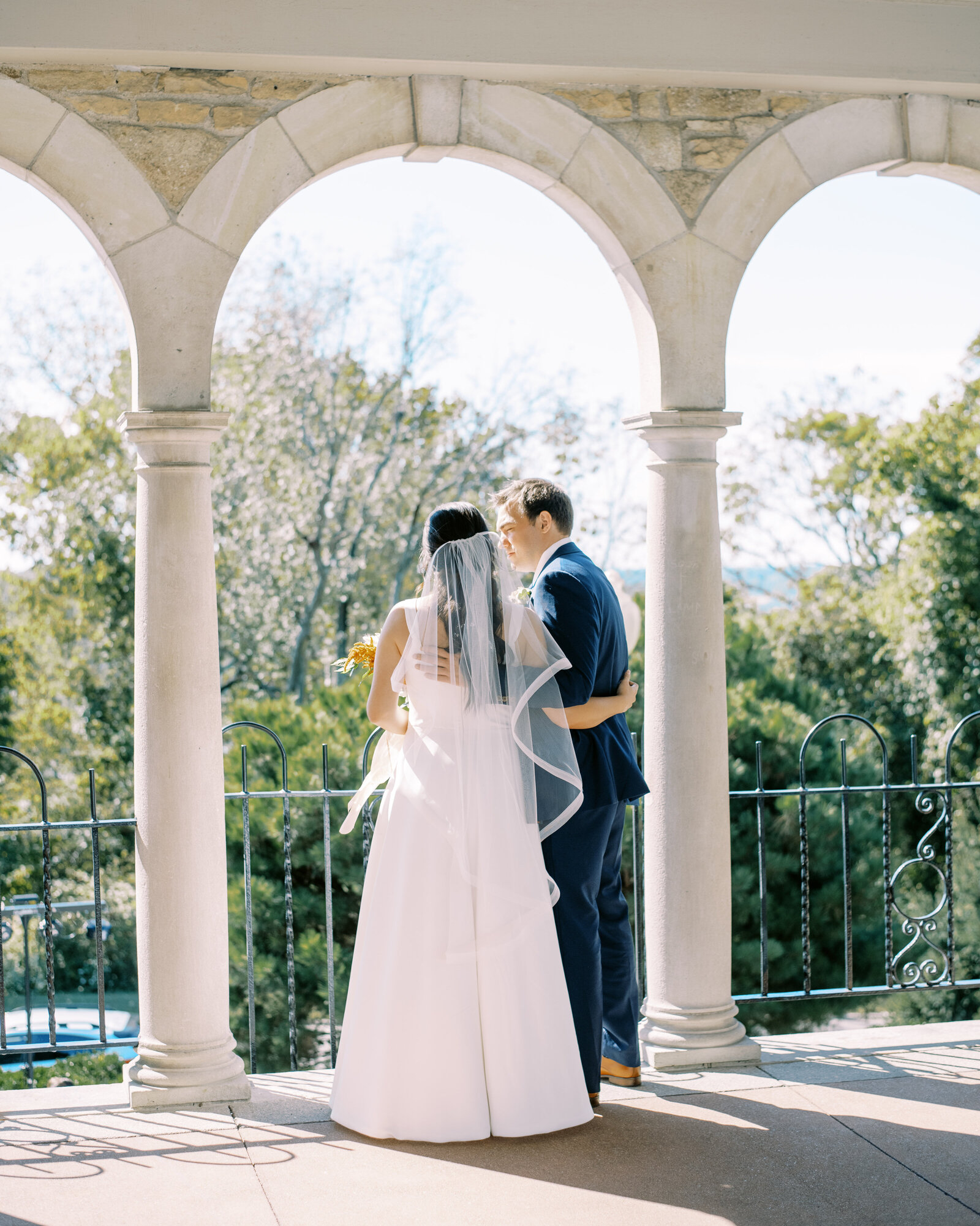 bride and groom overlook side of pavilion