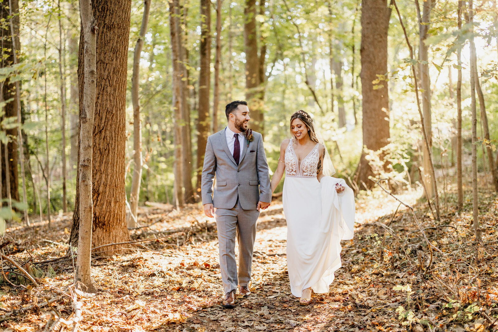 tattoo bride and groom walking in woods