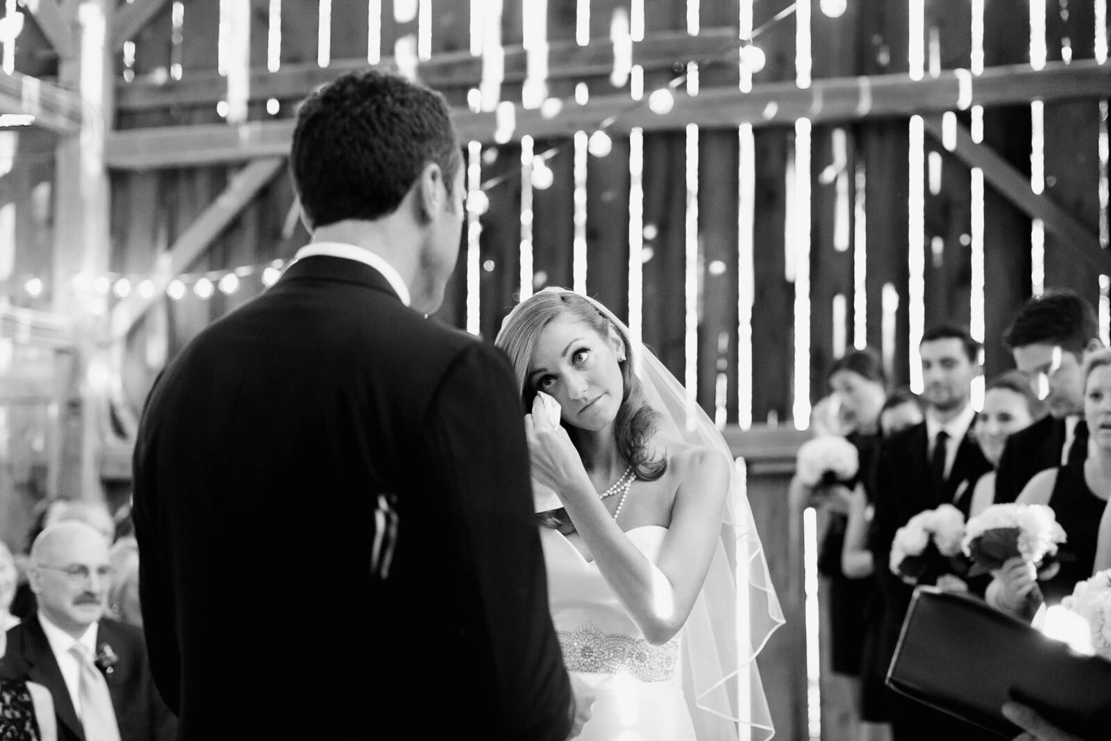 bride crying at barn ceremony