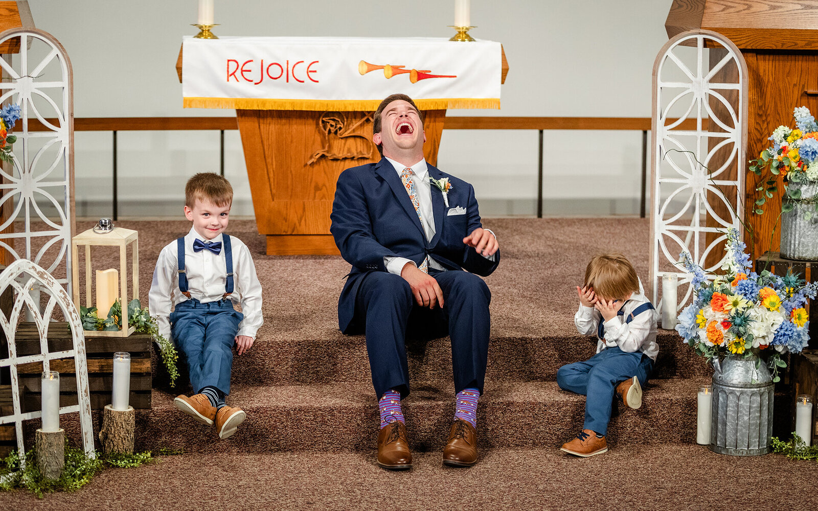 Capturing a moment of the groom with ring bearers