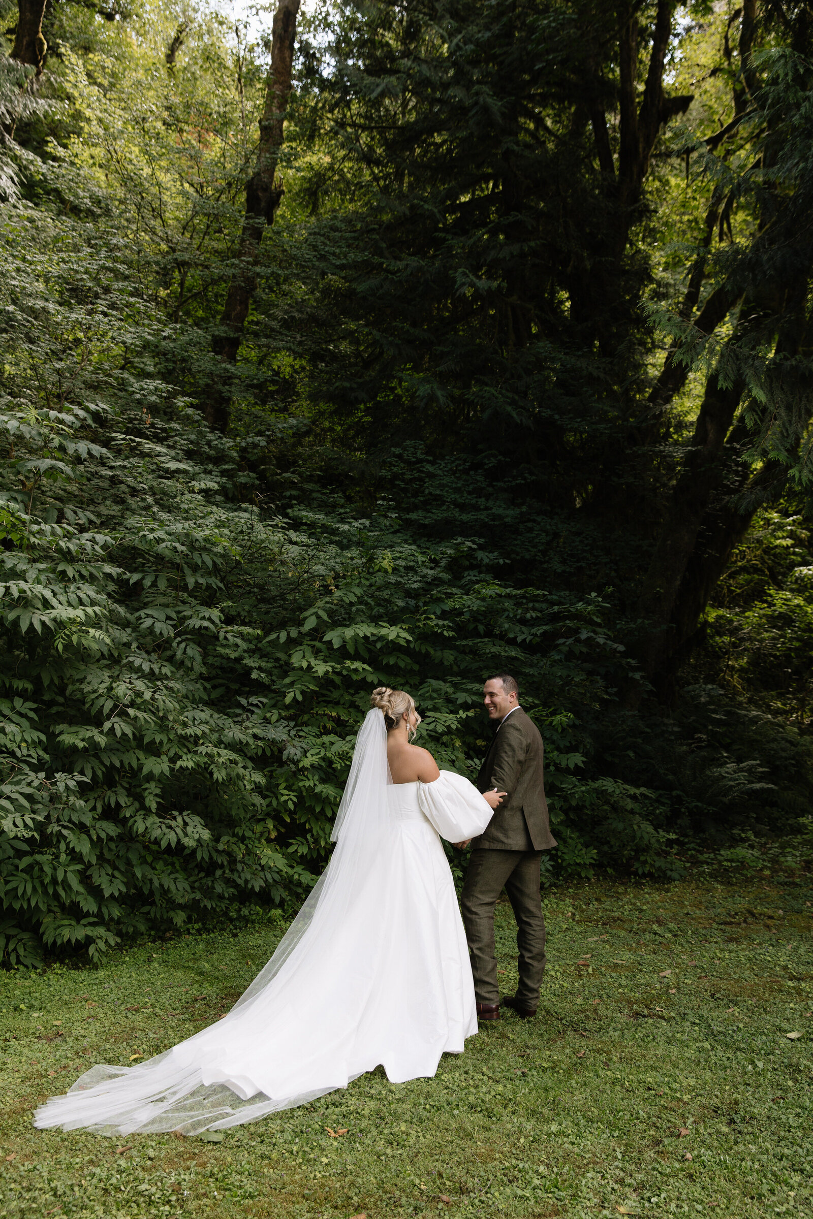 Bride and groom first look moment by Erica Rochelle, Washington wedding photographers in Seattle