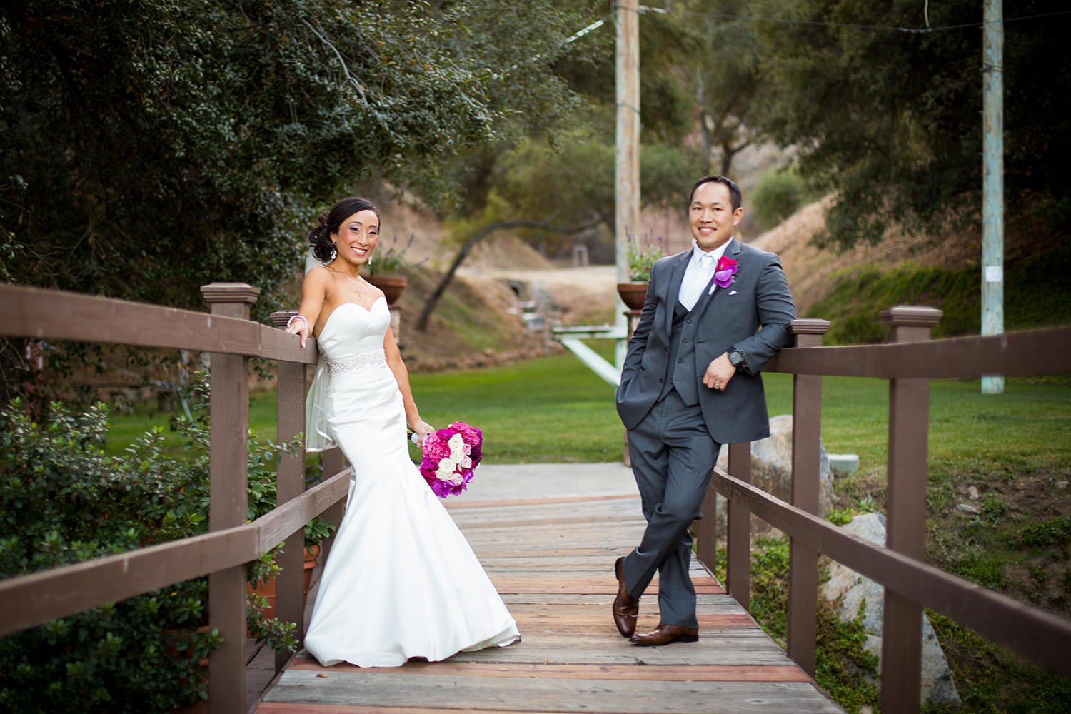 bride and groom on bridge at los willows