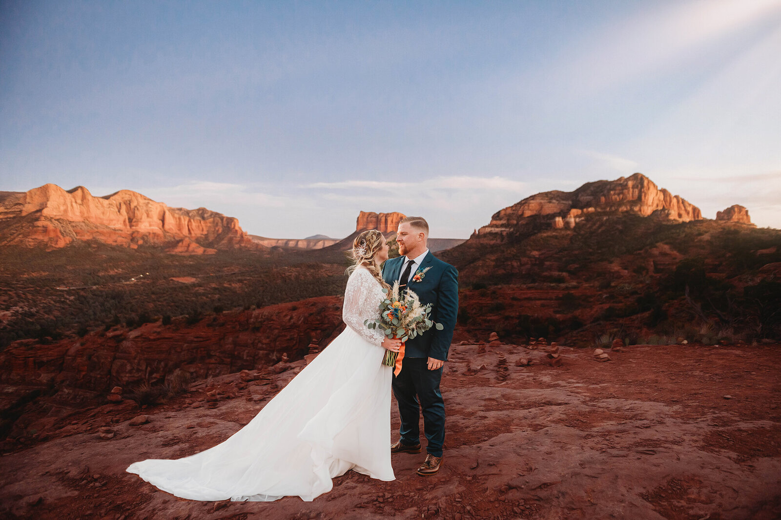 Bride & Groom pose for newlywed portraits after their Micro-Wedding in Sedona Arizona.