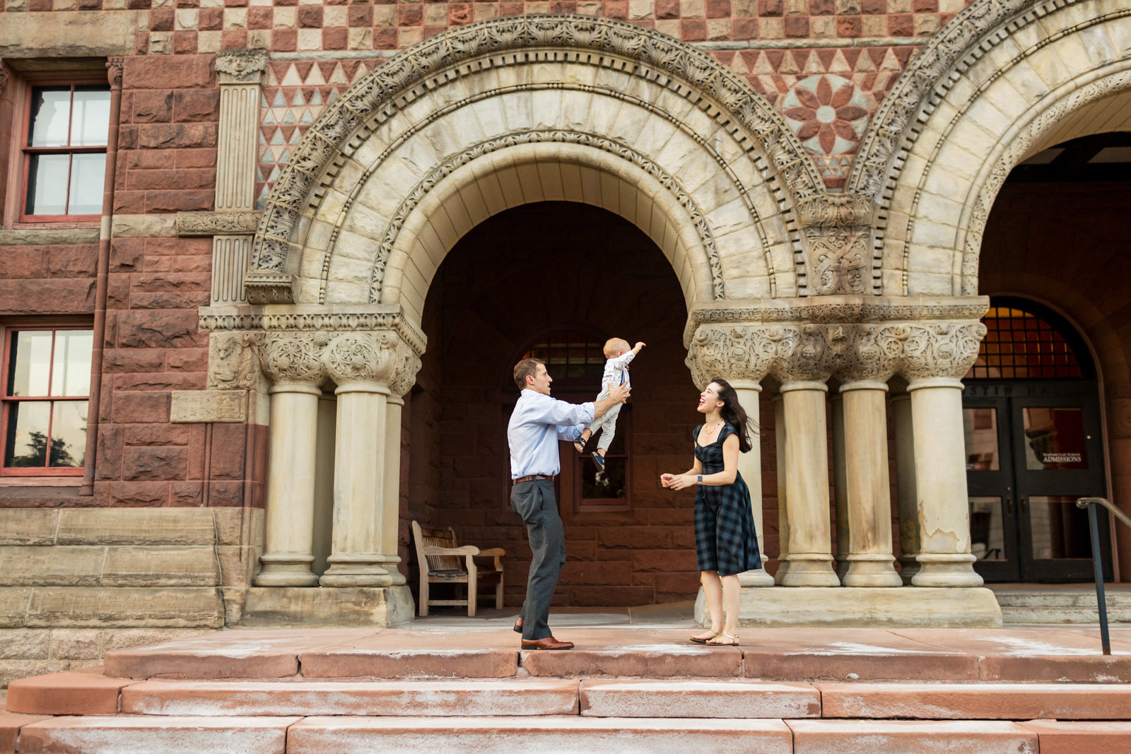 family play on building steps during photoshoot