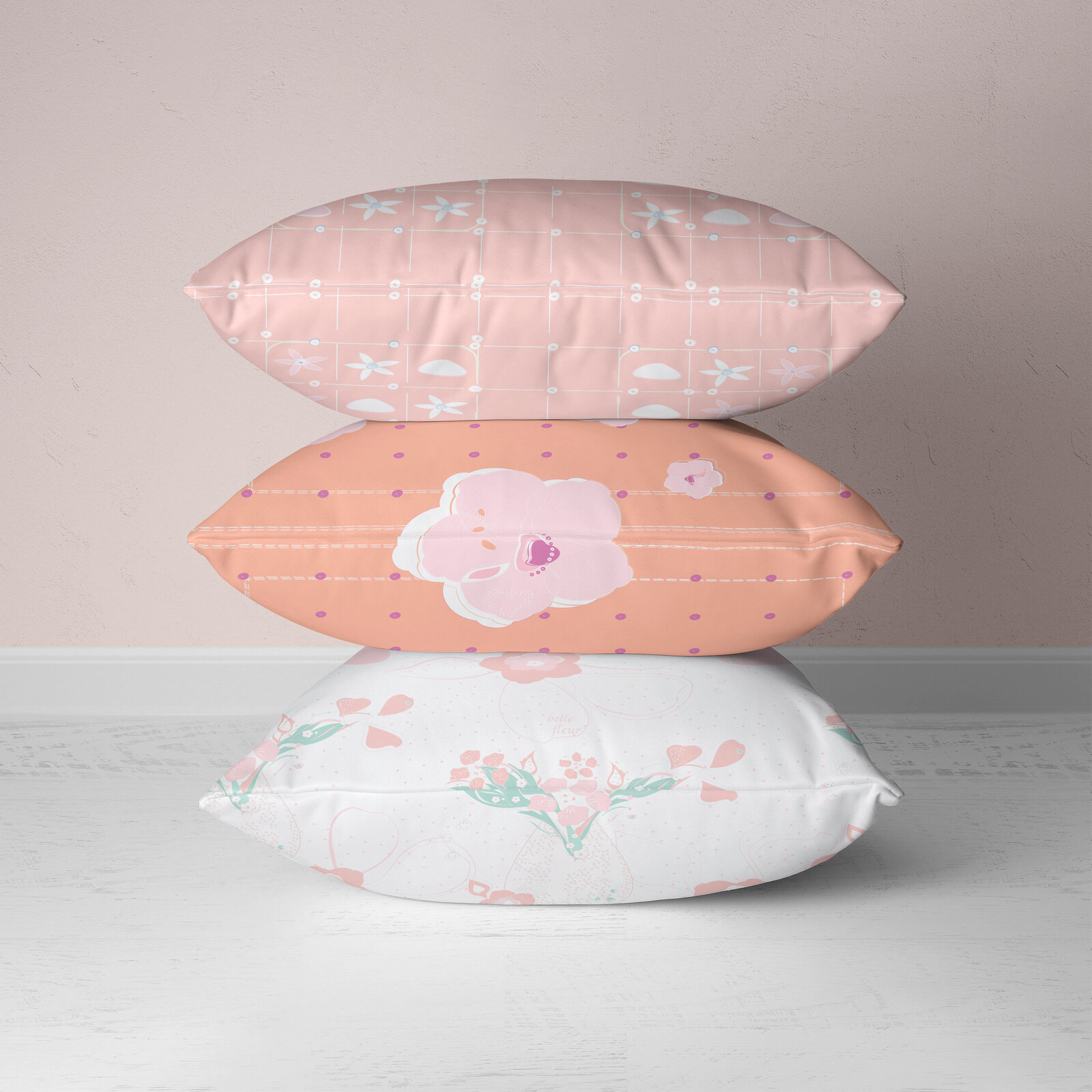 stack of pink and white patterned pillows