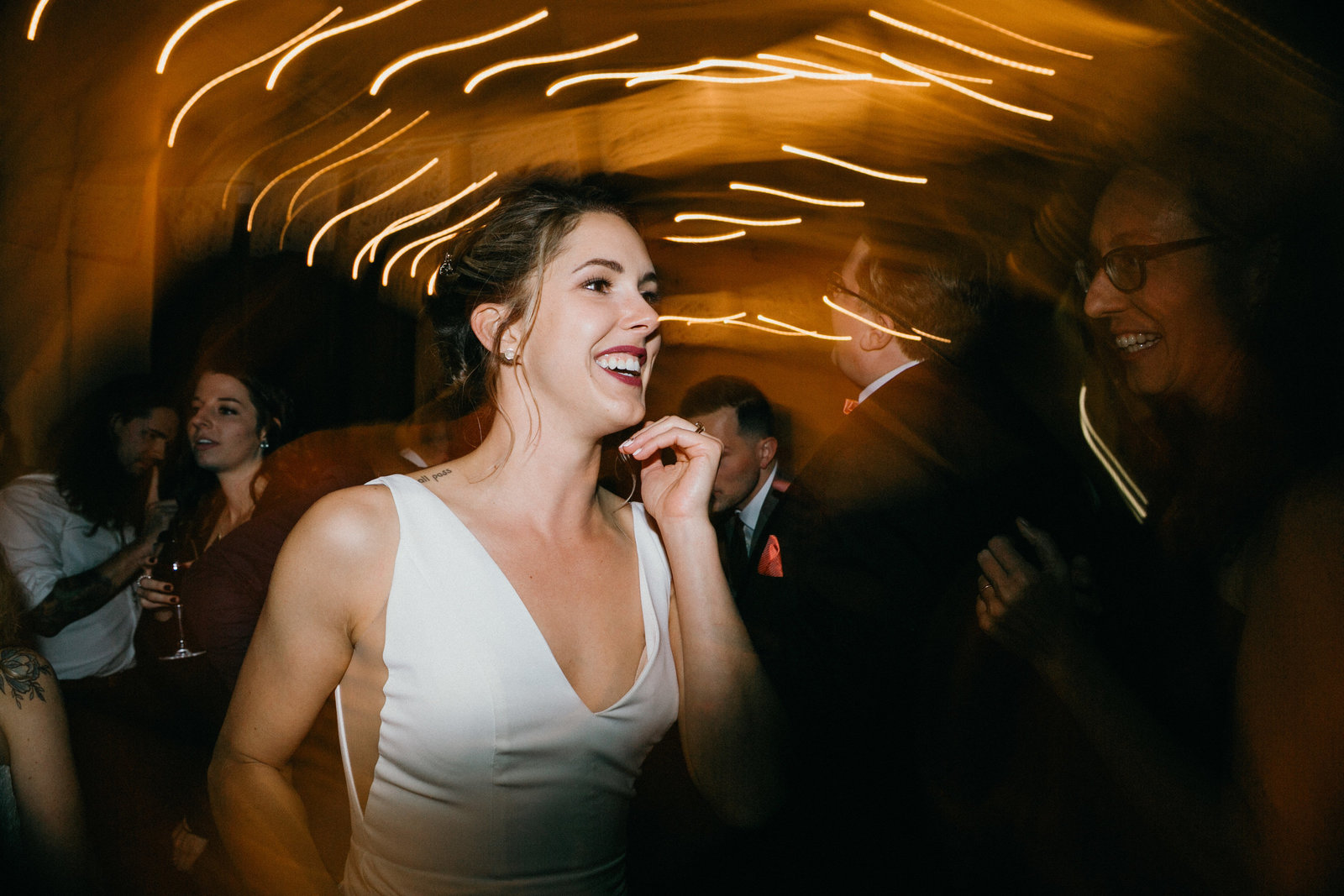 Artistic shot of the bride on the dance floor at his unconventional wedding venue.