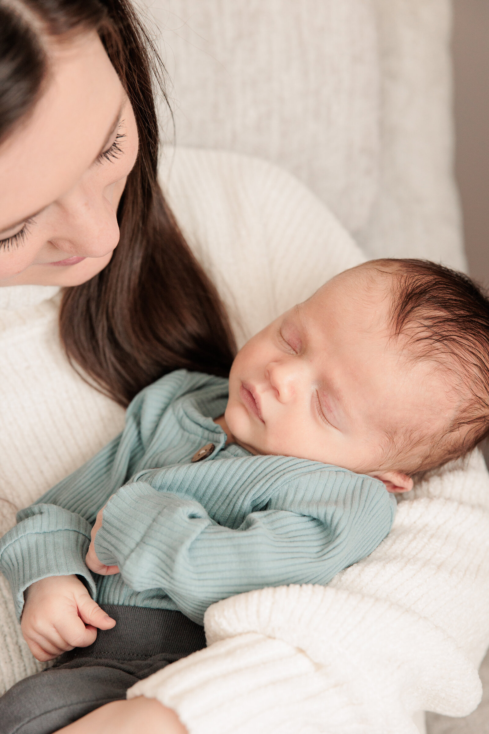 Akron Newborn photographer light and airy natural light motherhood snuggling baby boy