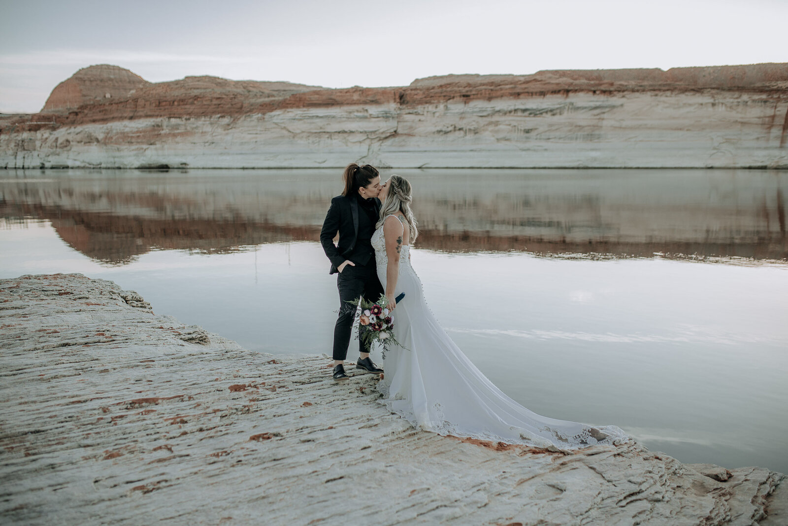 lgbtq elopement in Page Arizona on lake powell with red and white cliffs