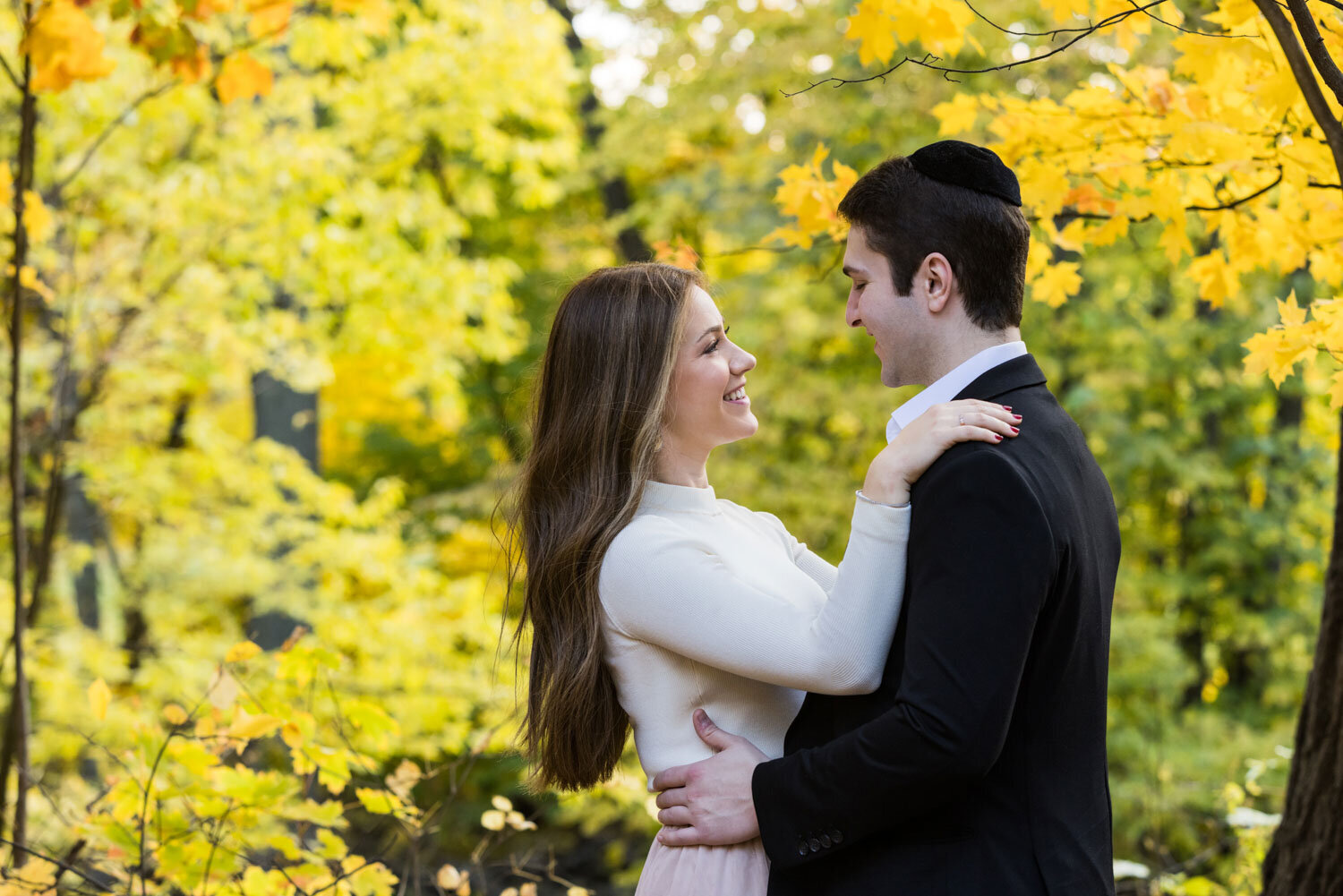 Couple facing and happily gazing at each other