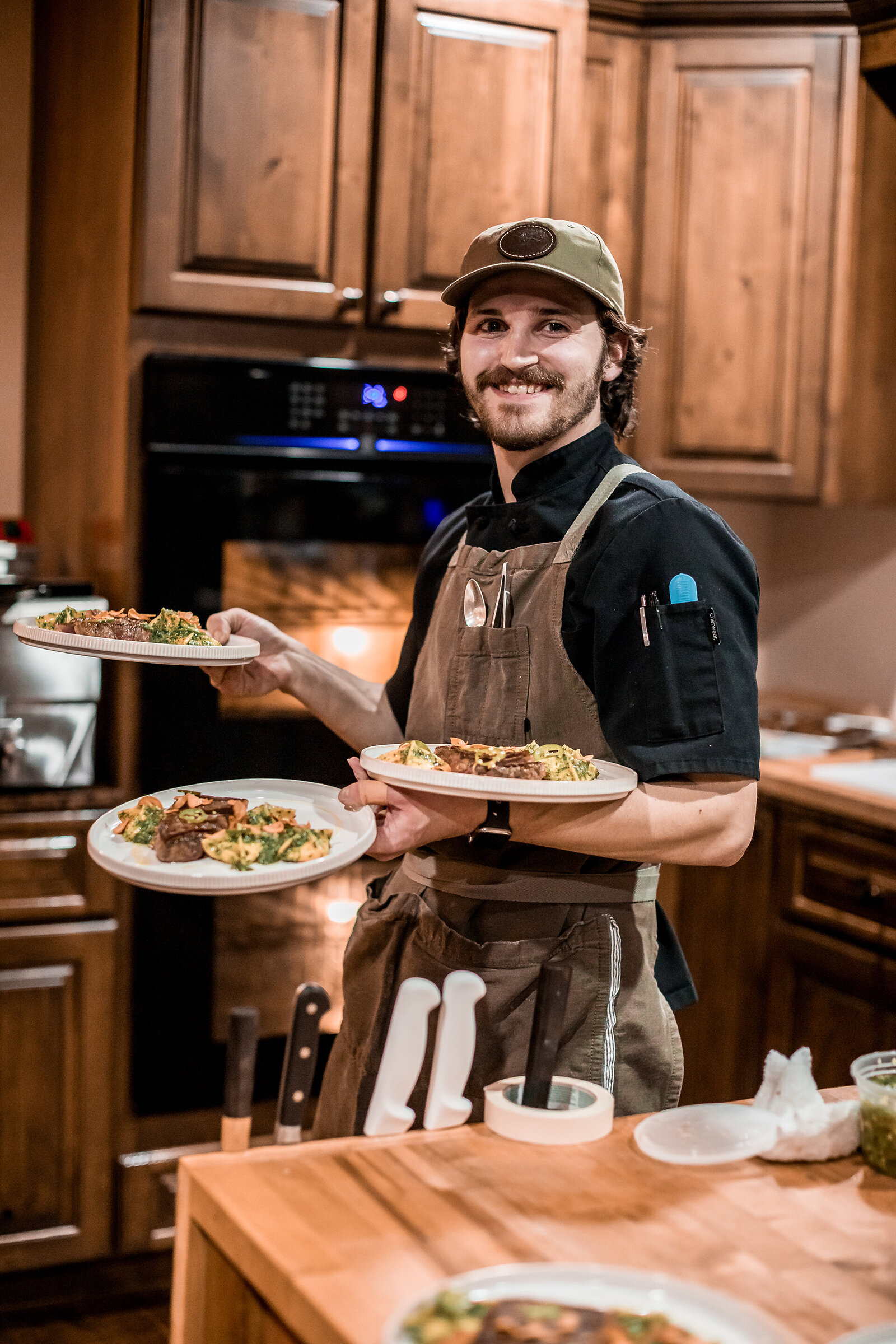 Kansas waterfowl lodge chef holding a plate of food