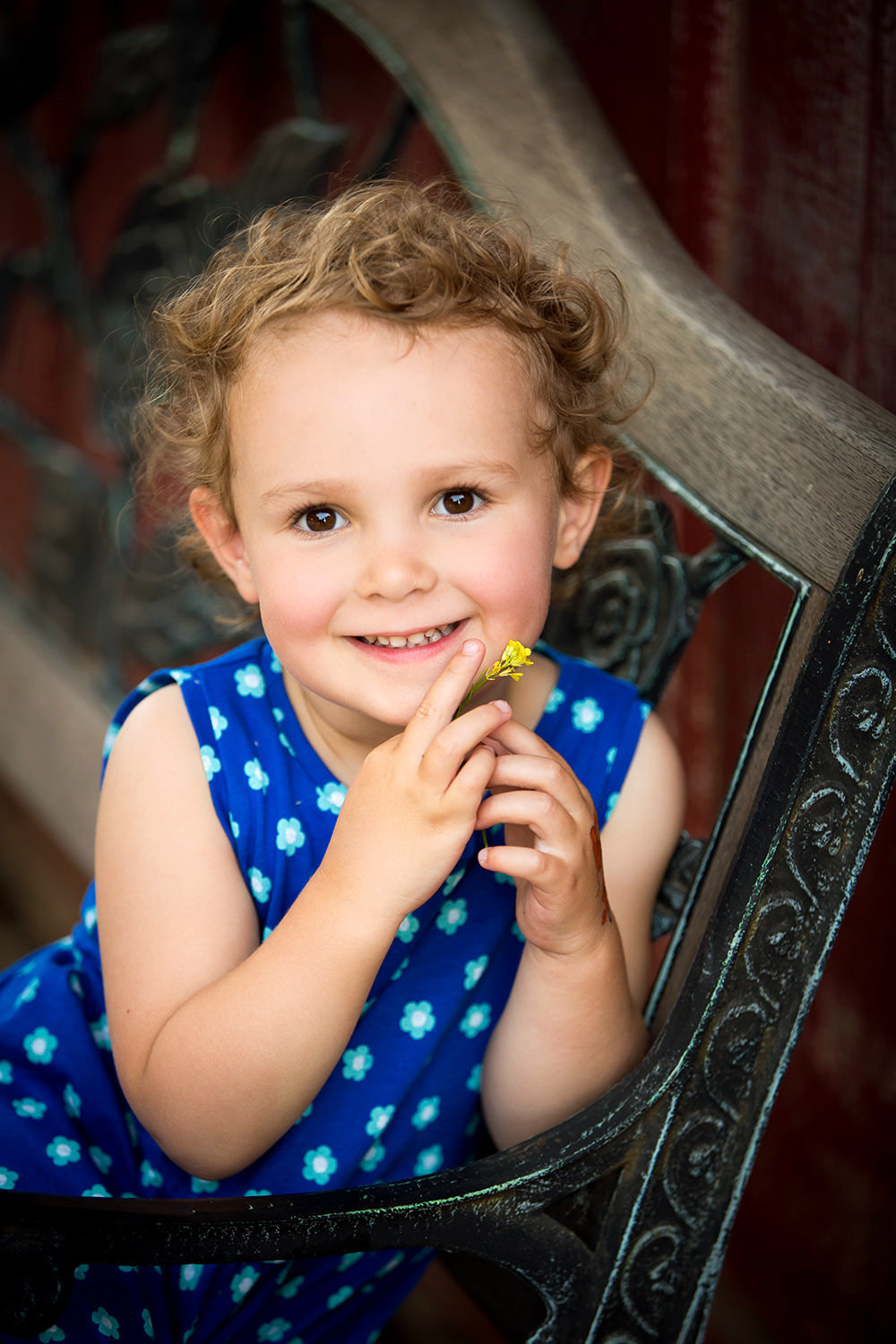 san diego family photographer | little girl outdoors holding flowers
