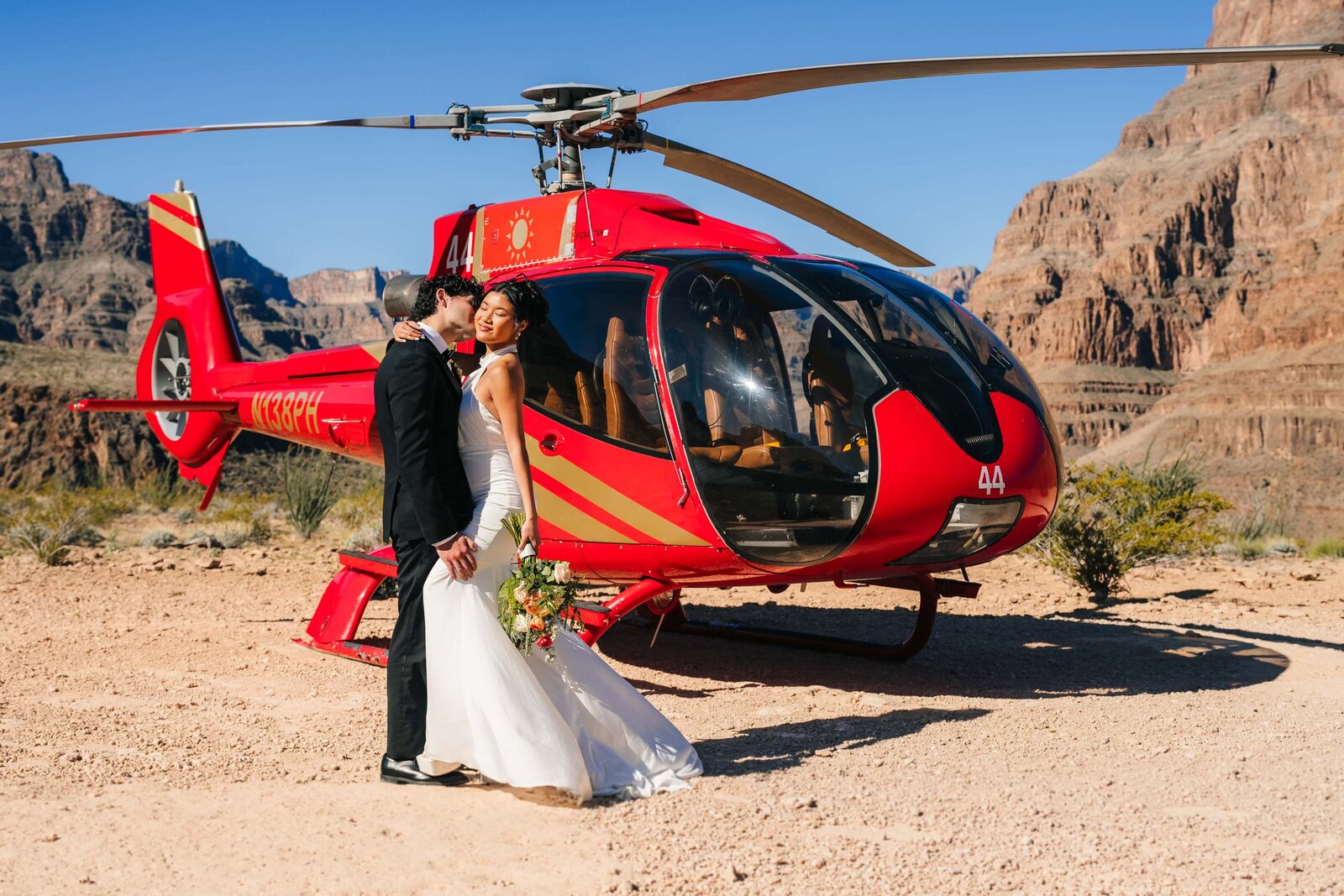 Couple enjoying the view during their helicopter elopement in Grand Canyon.