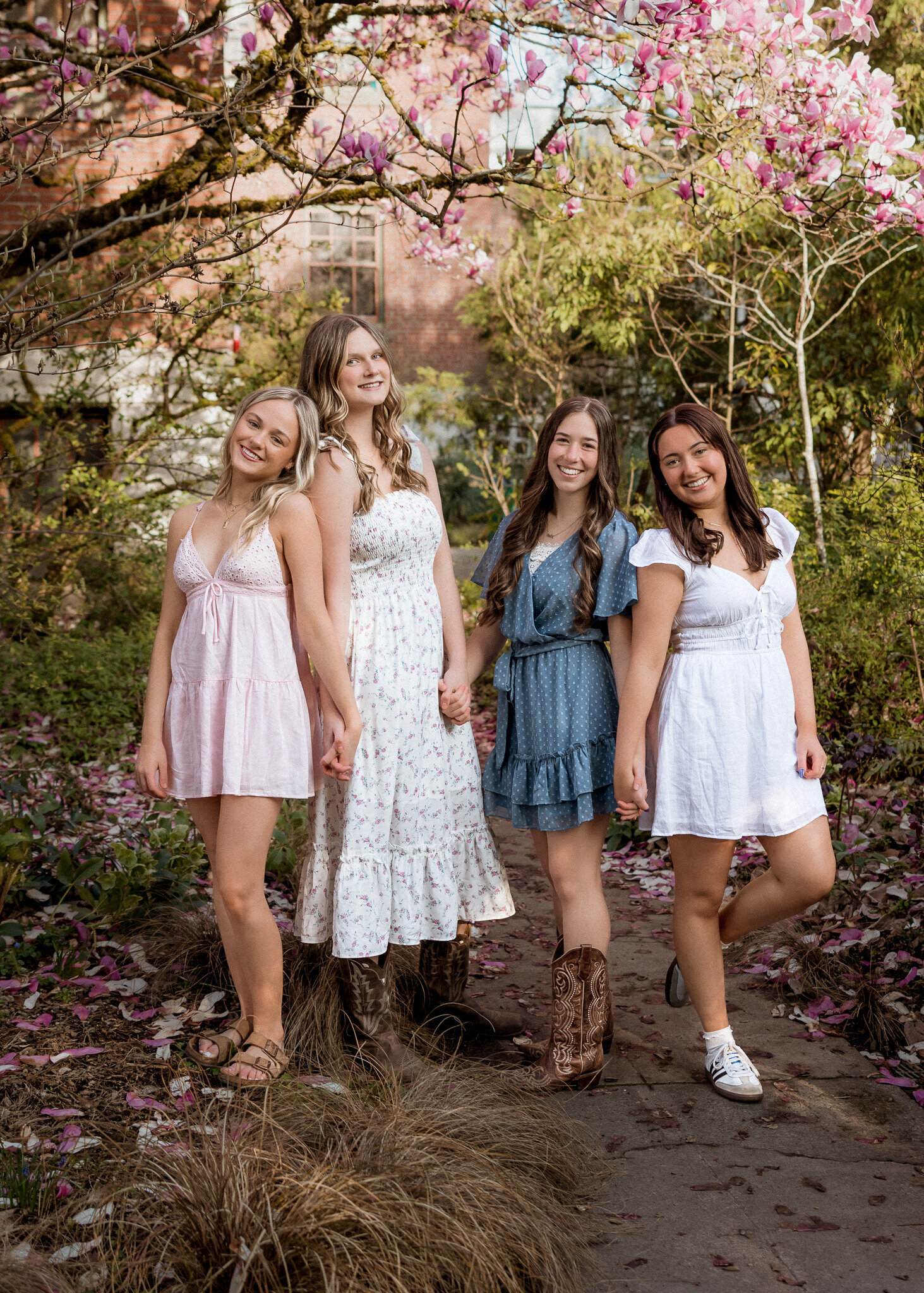 Group of girls posing for senior portraits at mcmenamins edgefield
