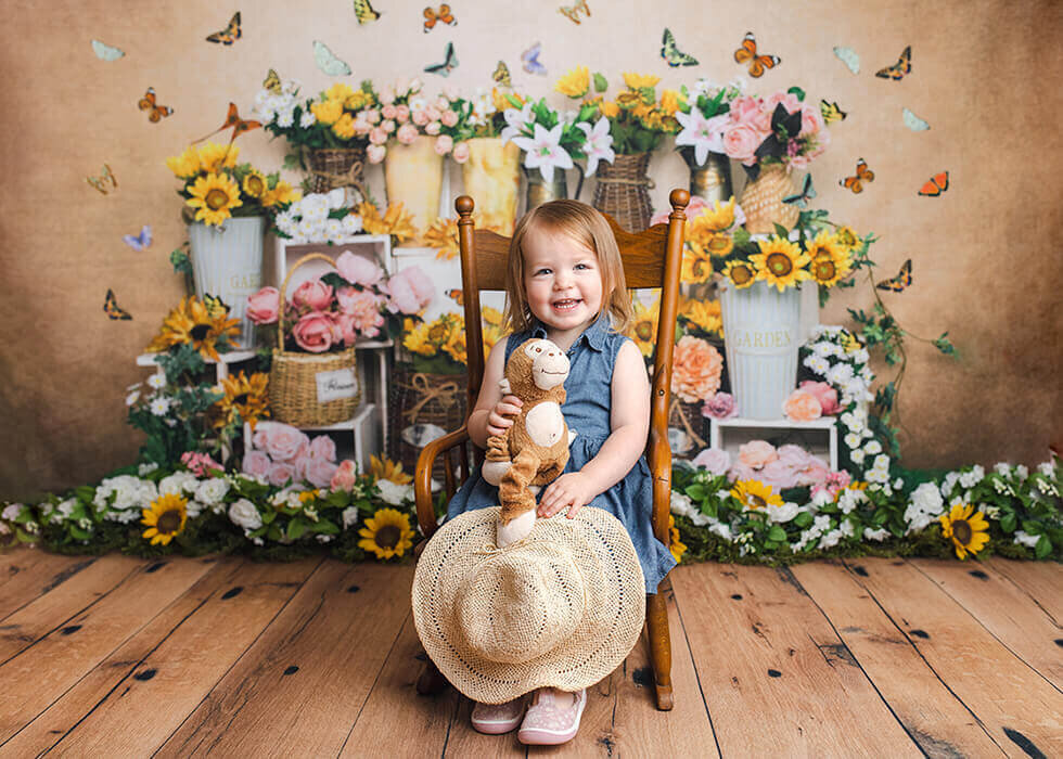 Little girl sitting on a chair with an Easter set in Davenport iowa