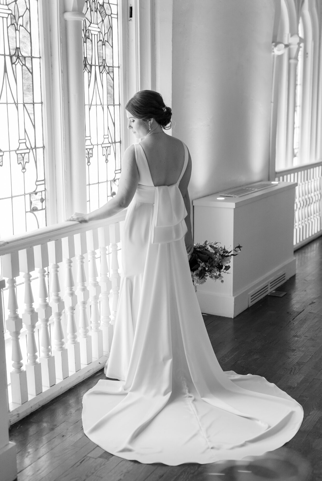 Bride's portraits in front of window