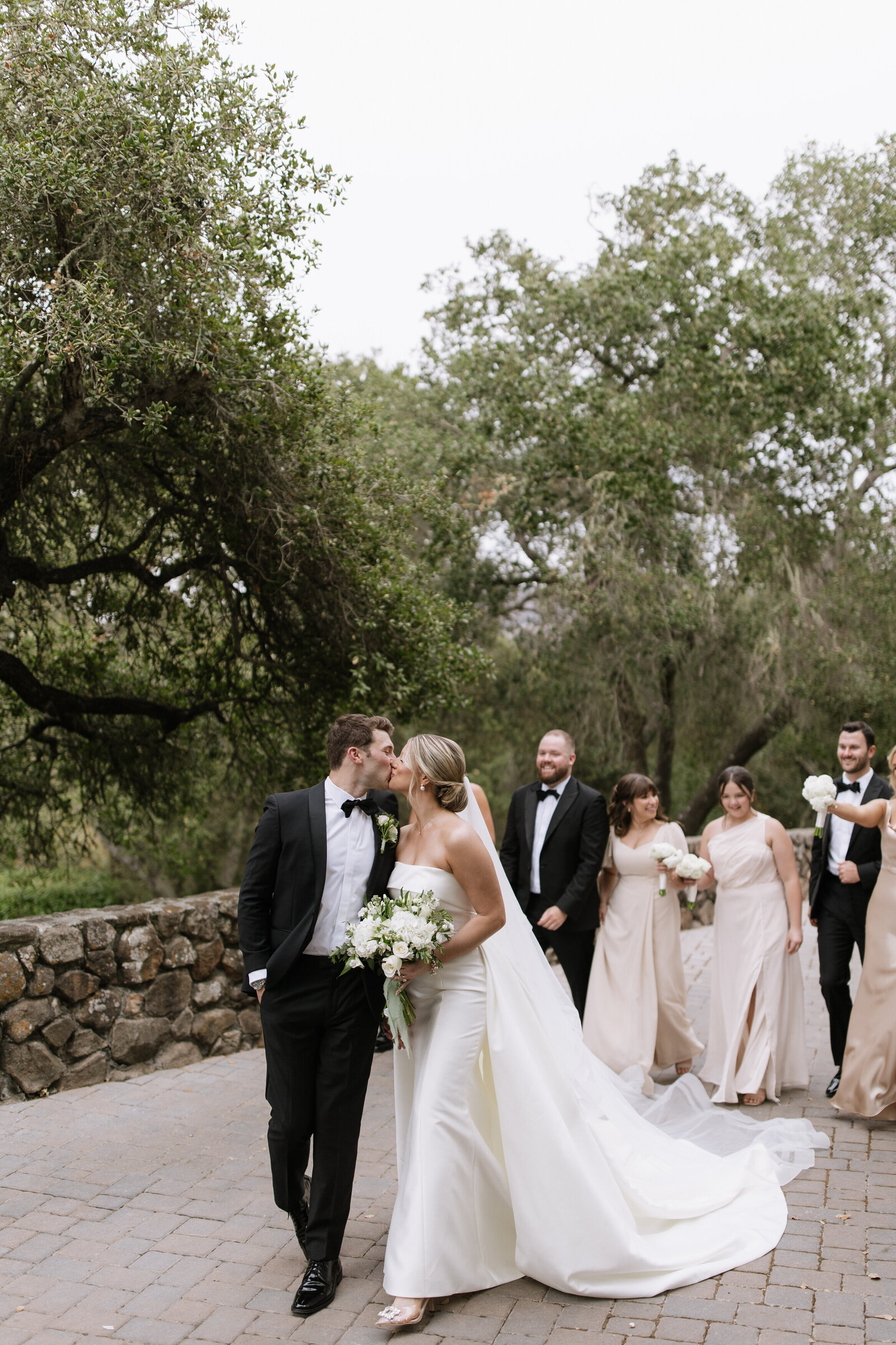 Bridal party walking in forest by Washington adventure elopement photographer