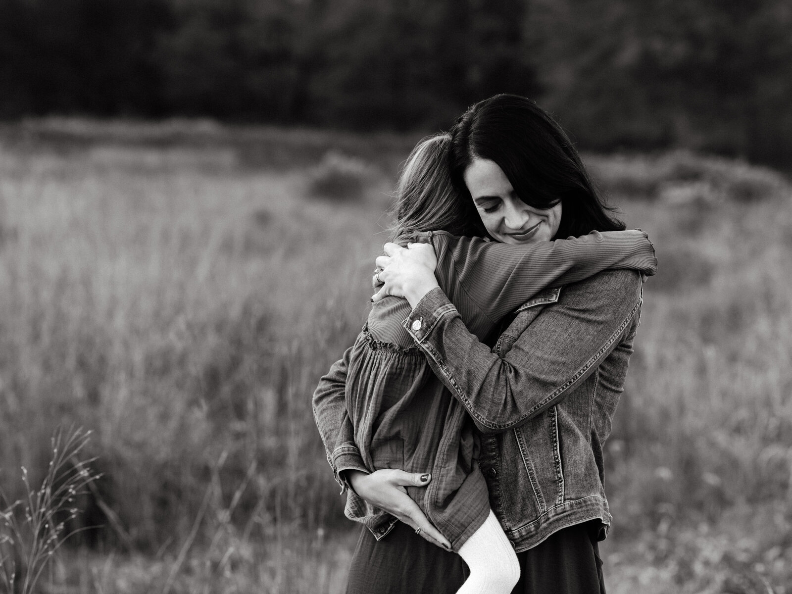 mother hugging daughter at park for family photos cleveland family photography