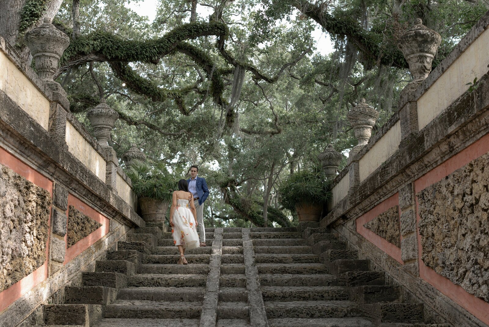 Couple standing on steps of the grounds of Vizcaya, Miami.