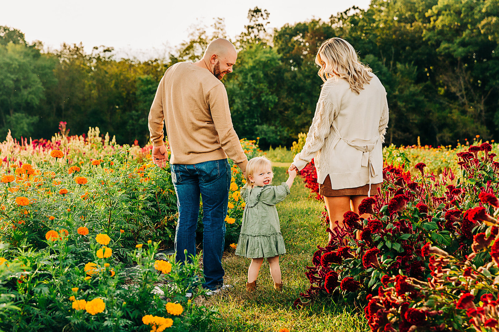 family photo in field of flowers