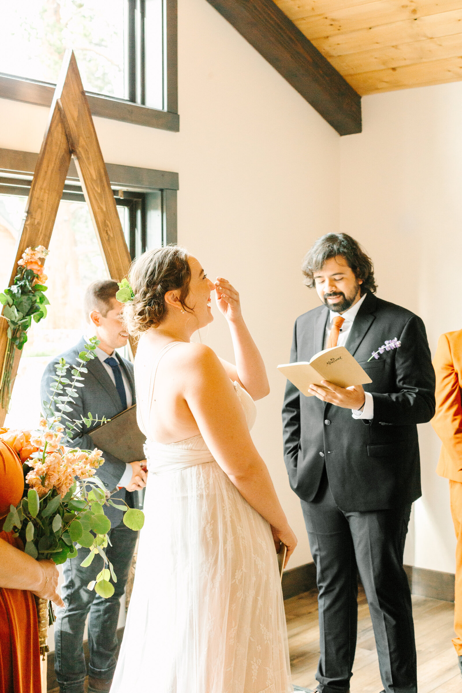 A couple celebrates their intimate elopement at a cabin at Big Bear Lake, California.
