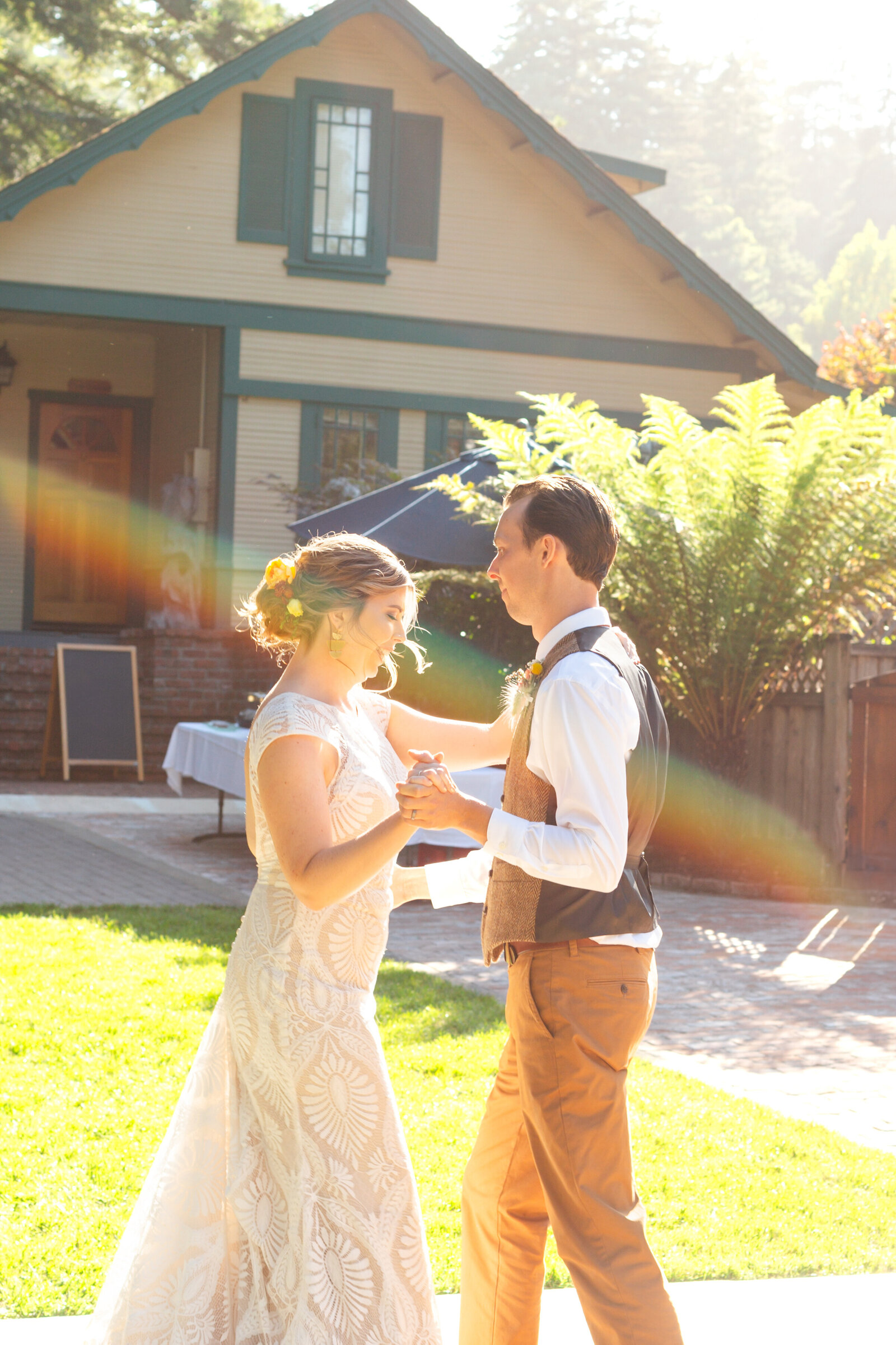 Bride and groom on their colorful wedding day in Santa Cruz, California in the redwood trees.