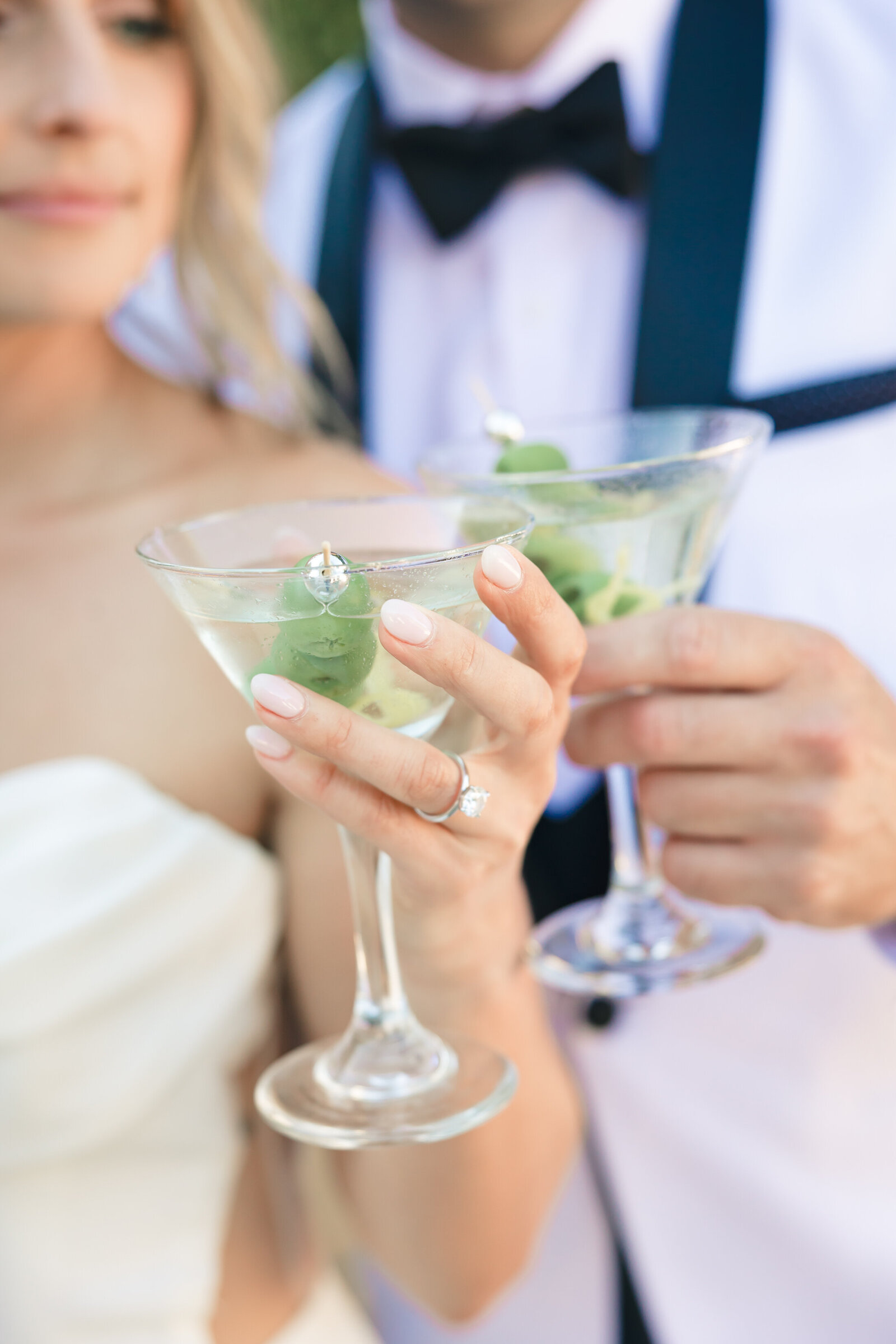 Couple holding martini glasses at Stone Pine Estates - Bay Area Wedding Photographer