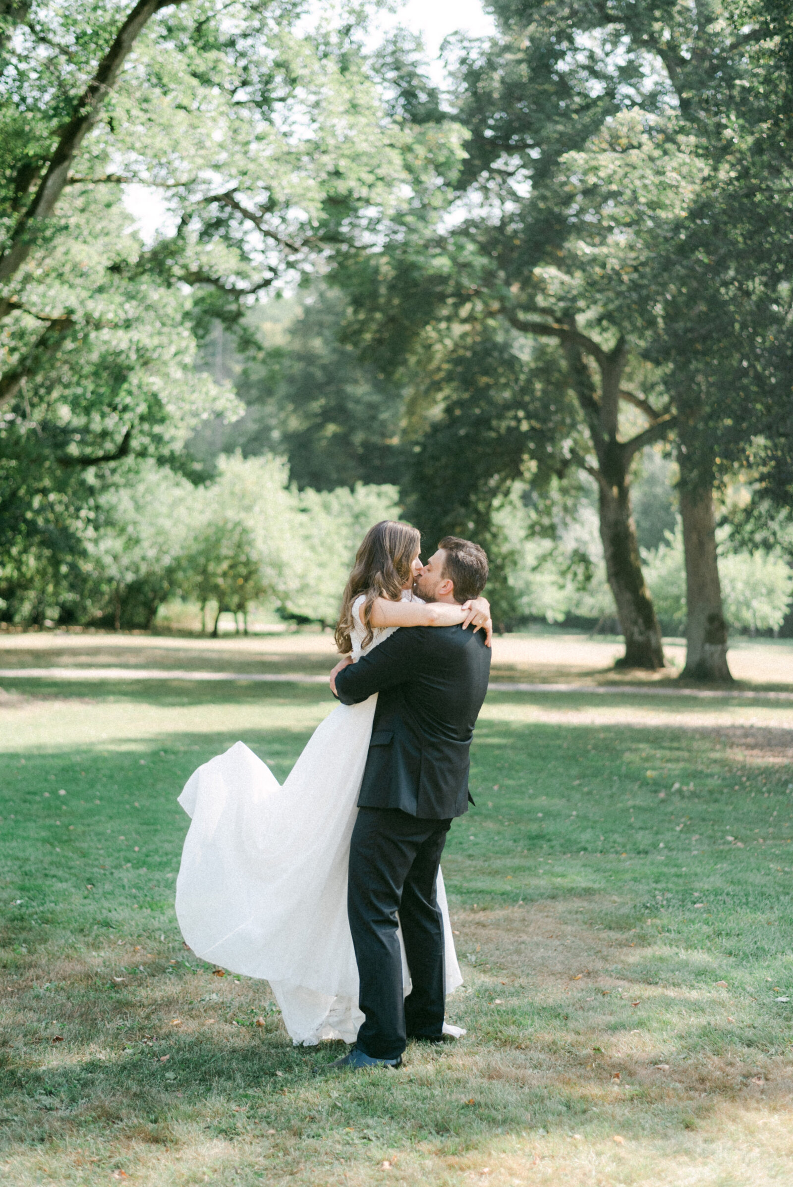 Bride hugging the groom in a romantic wedding photograph by wedding photographer Hannika Gabrielsson.