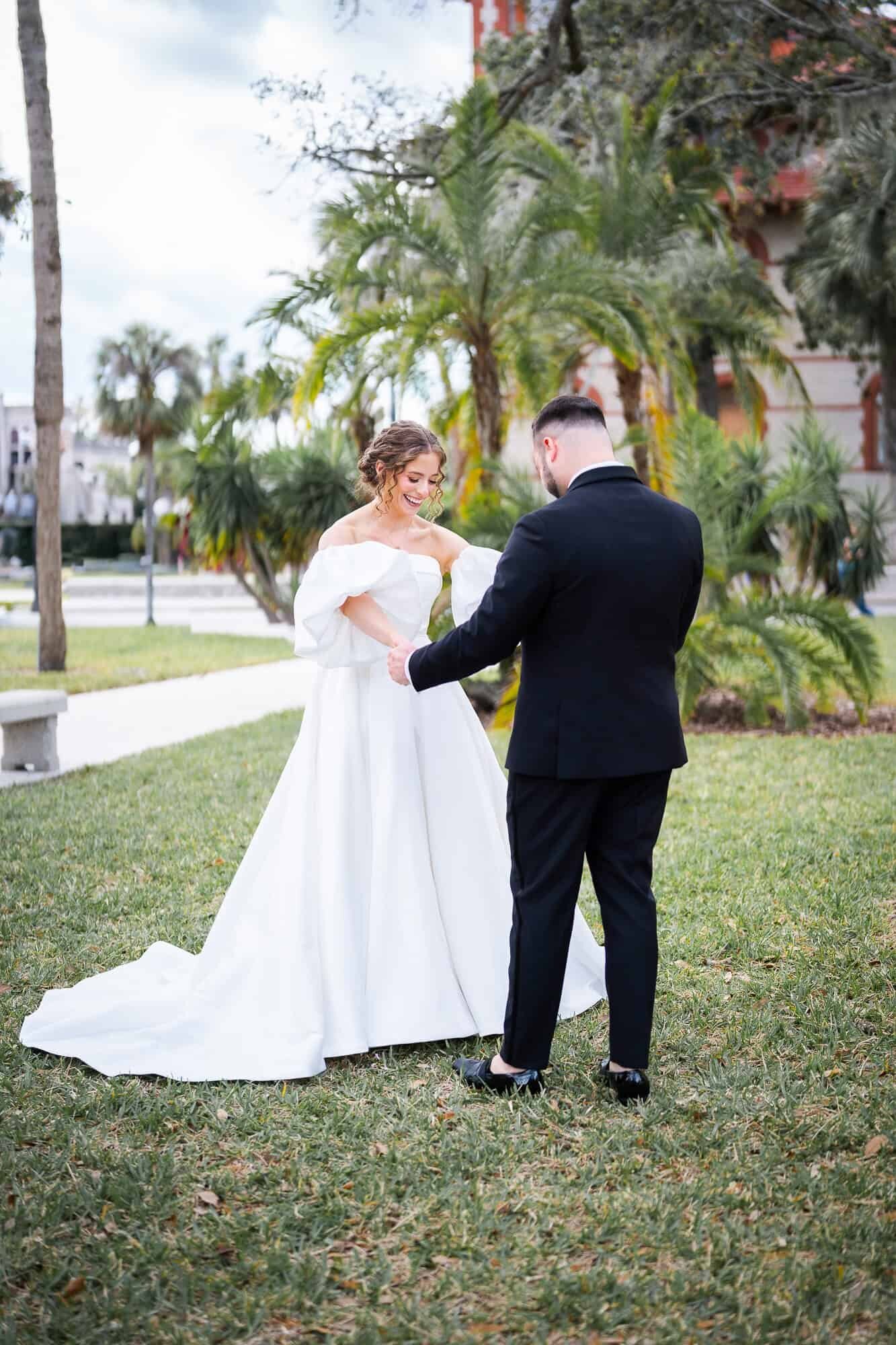 groom admiring bride during first look at Casa Monica Wedding venue in St Augustine