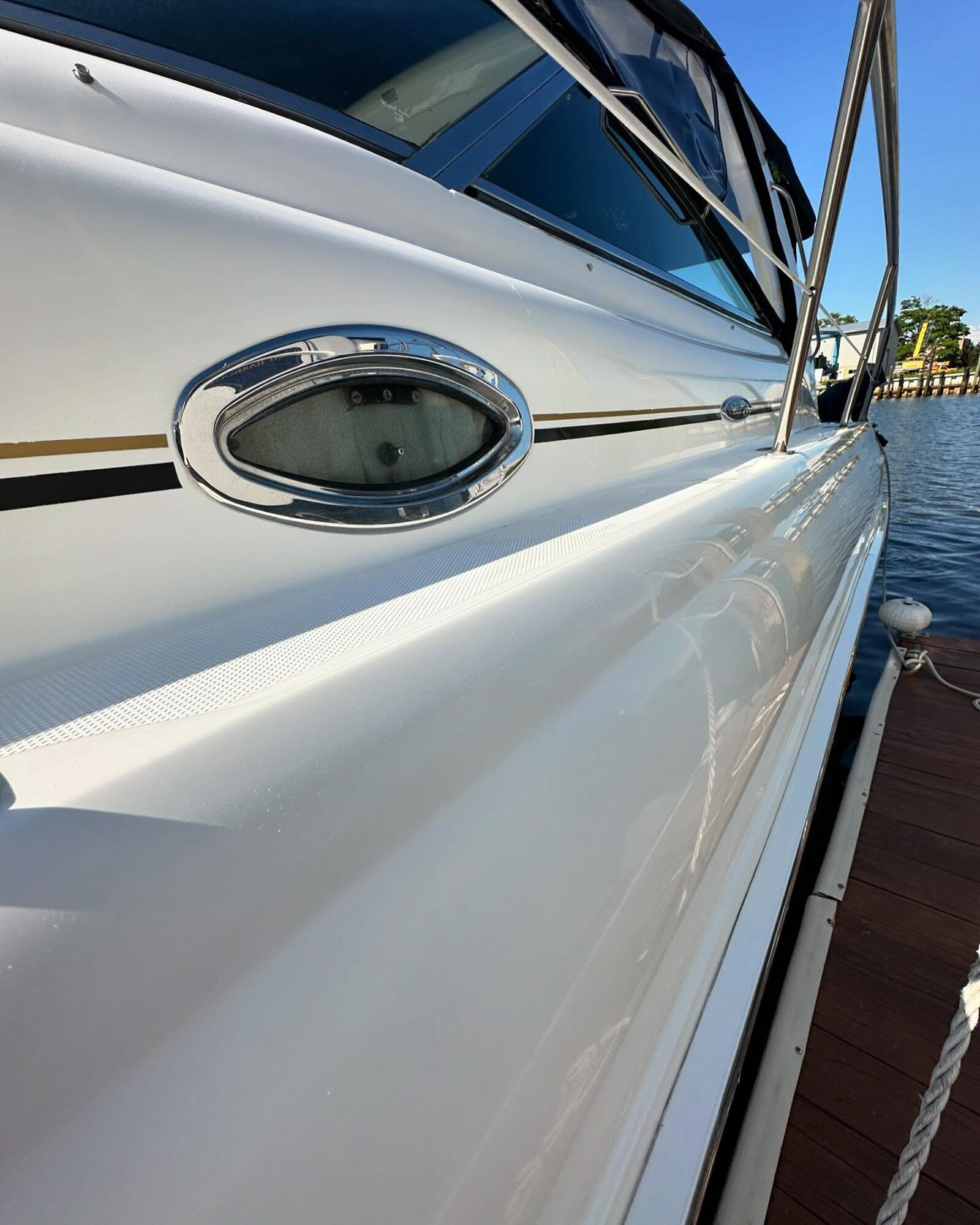 Glossy side of a boat after detailing services