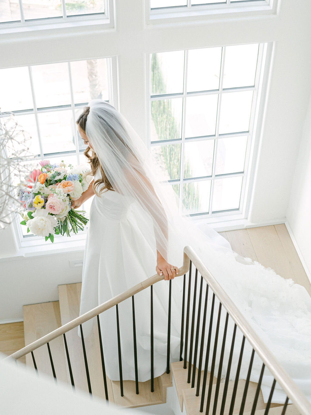 Bride walking down the stairs ready for Alys beach wedding