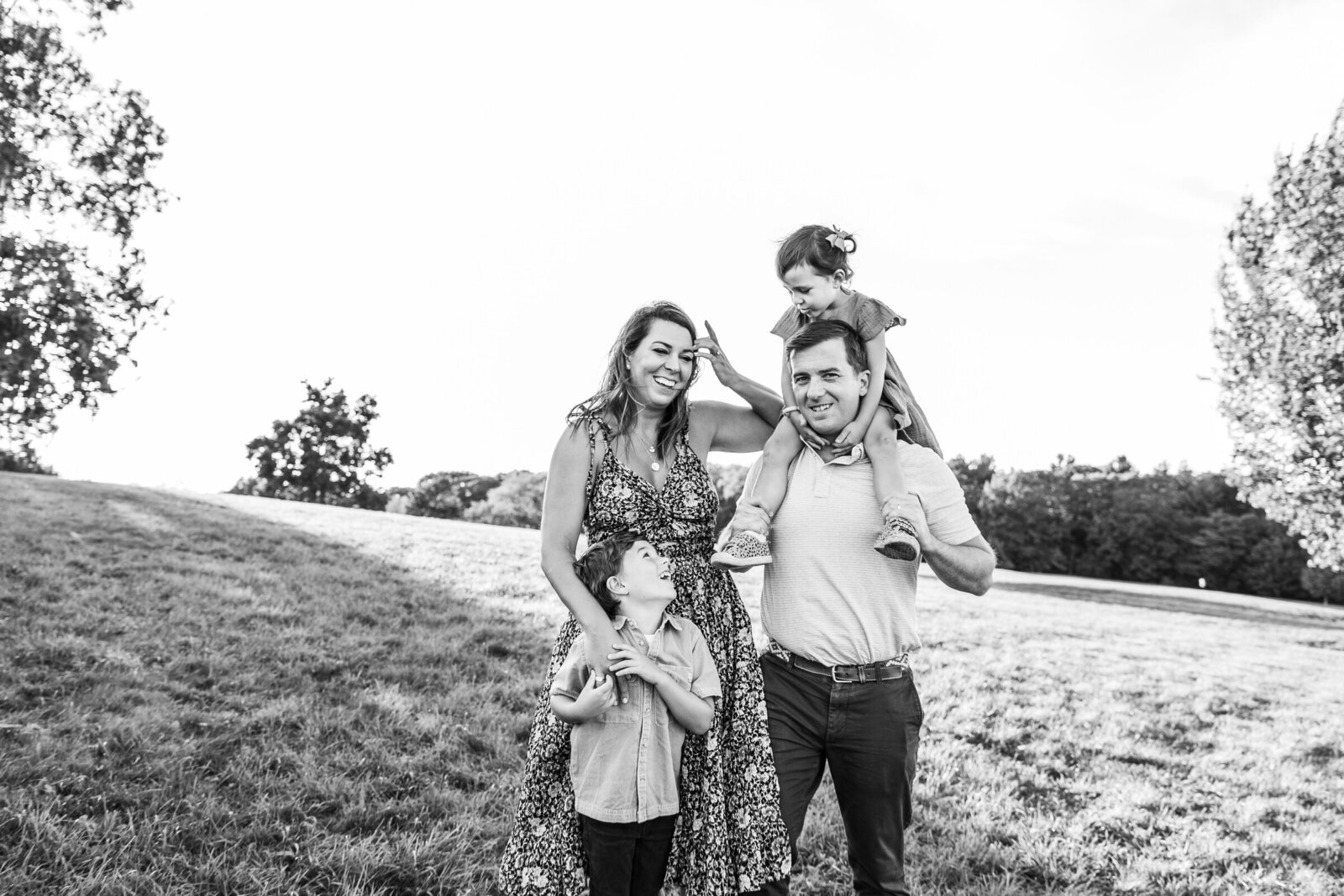 black and white candid image of family in boston suburbs