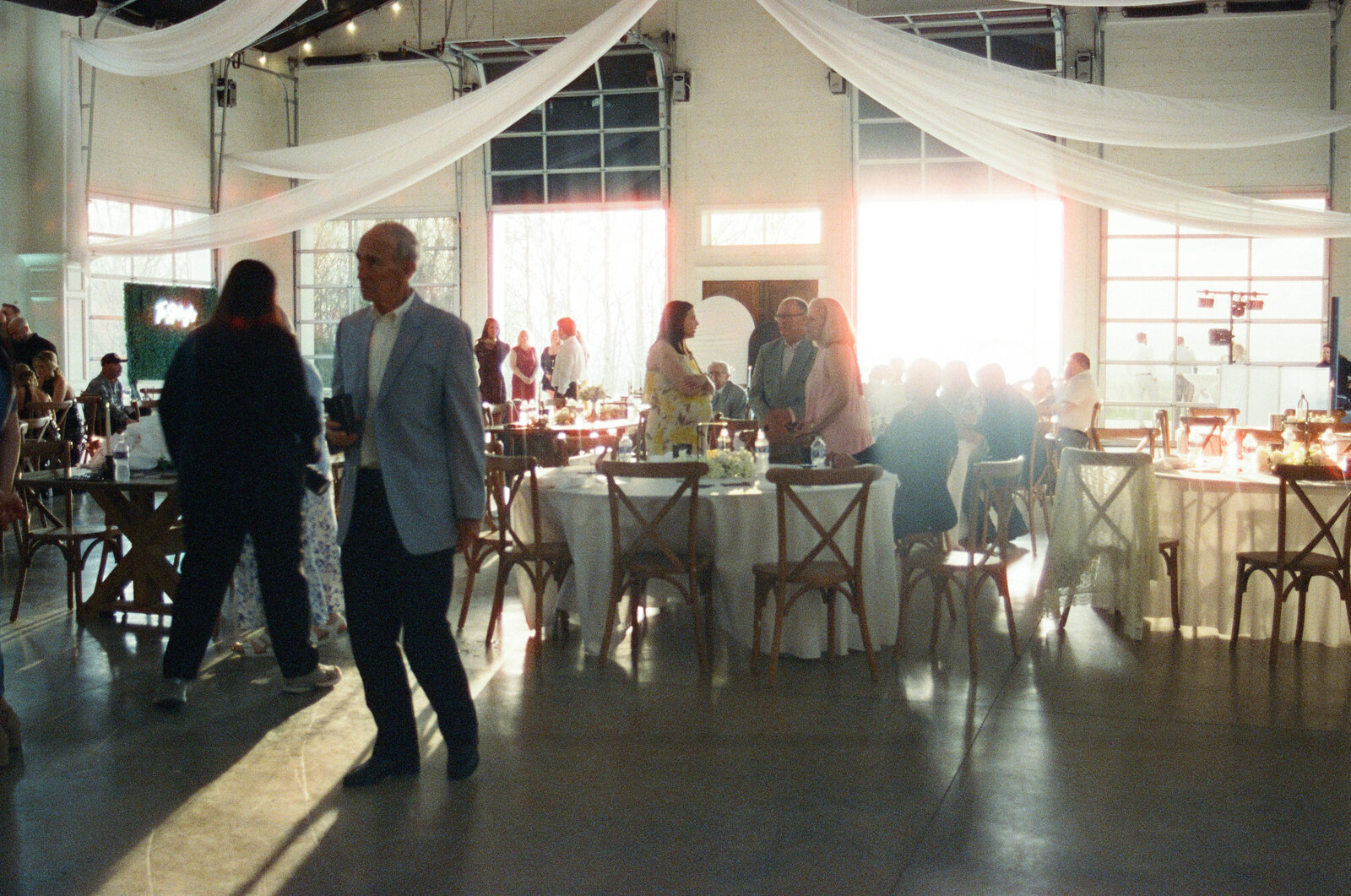 guests enjoy a quiet moment in golden-hour light at a Chattanooga wedding venue