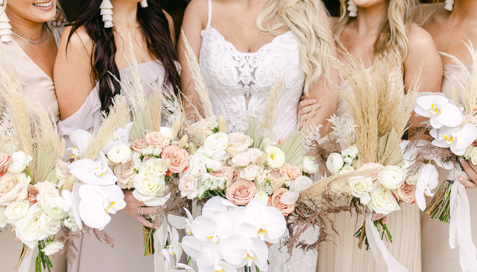 bride and bridal party with flowers